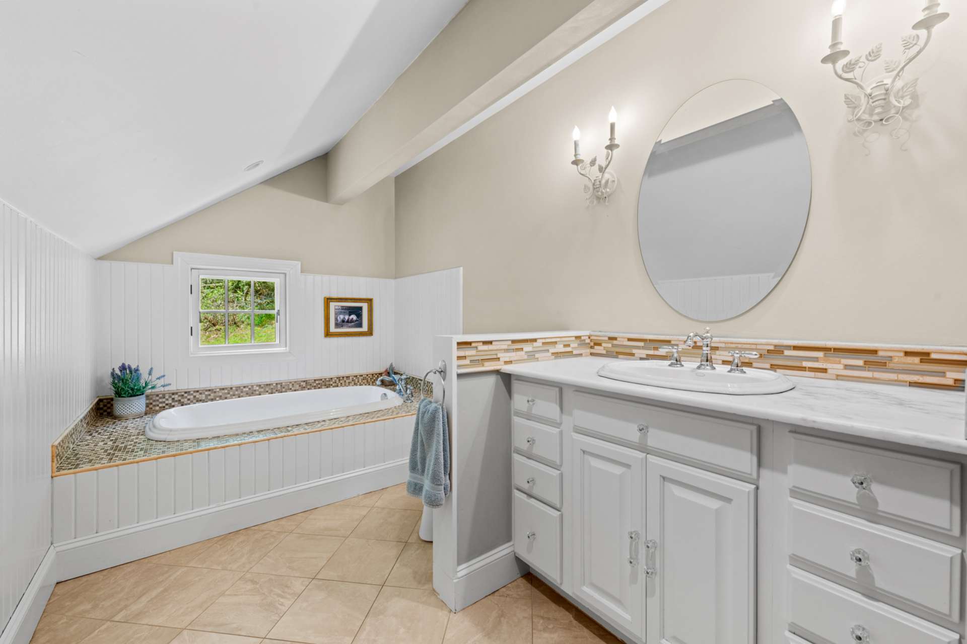 A deep soaking tub invites you to unwind and soothe the senses.
