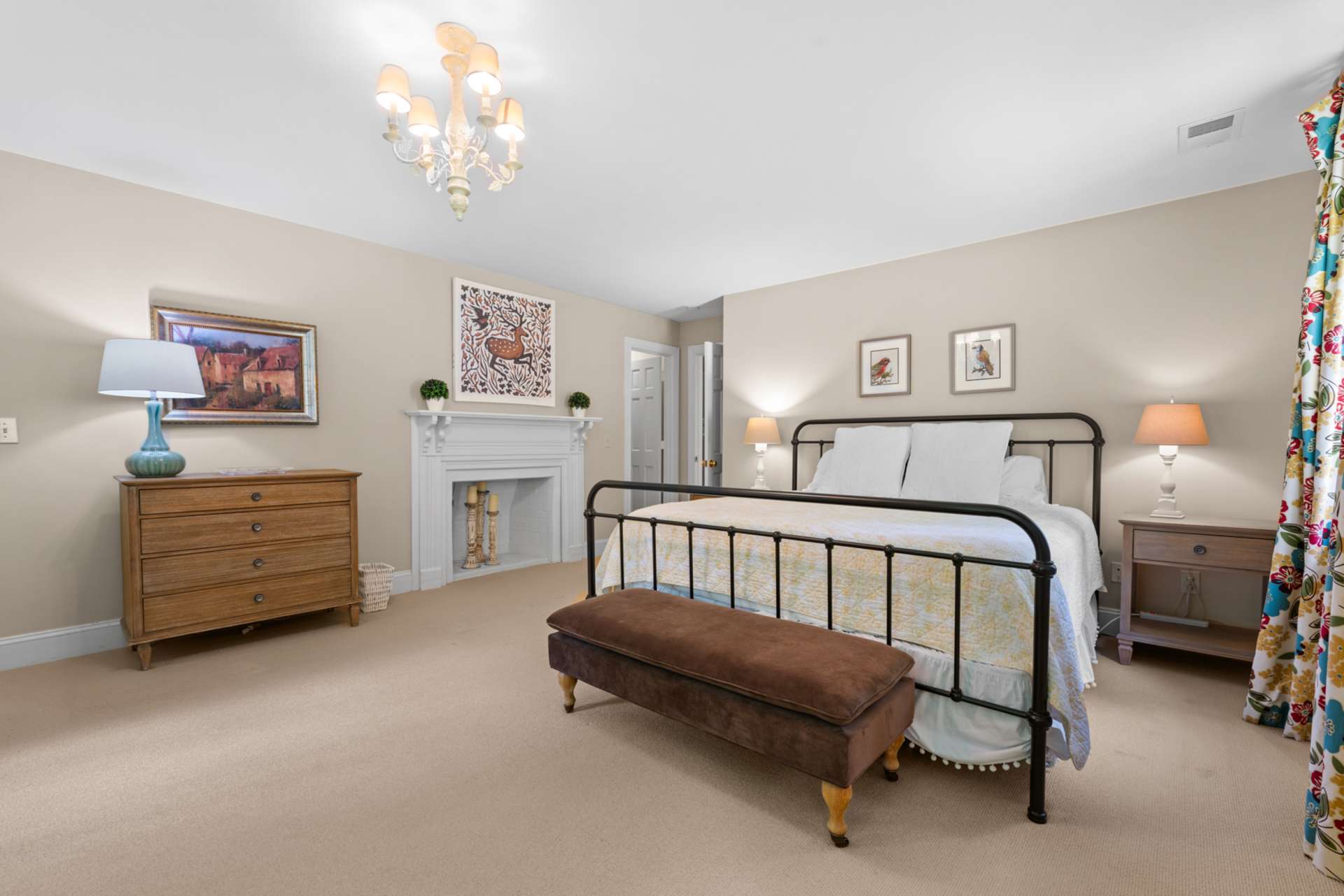 An ensuite bath and generous walk-in closet make this space as functional as it is inviting.
