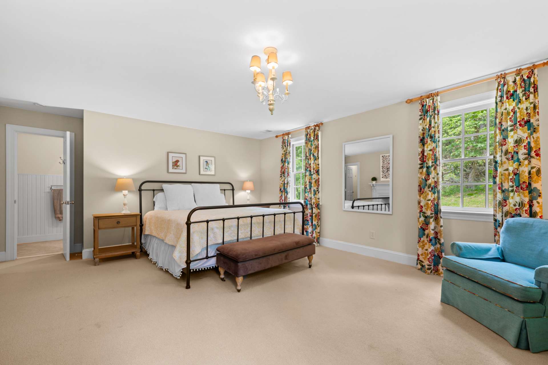 The second upper-level bedroom mirrors the home’s elegance—quiet, spacious, and full of charm.