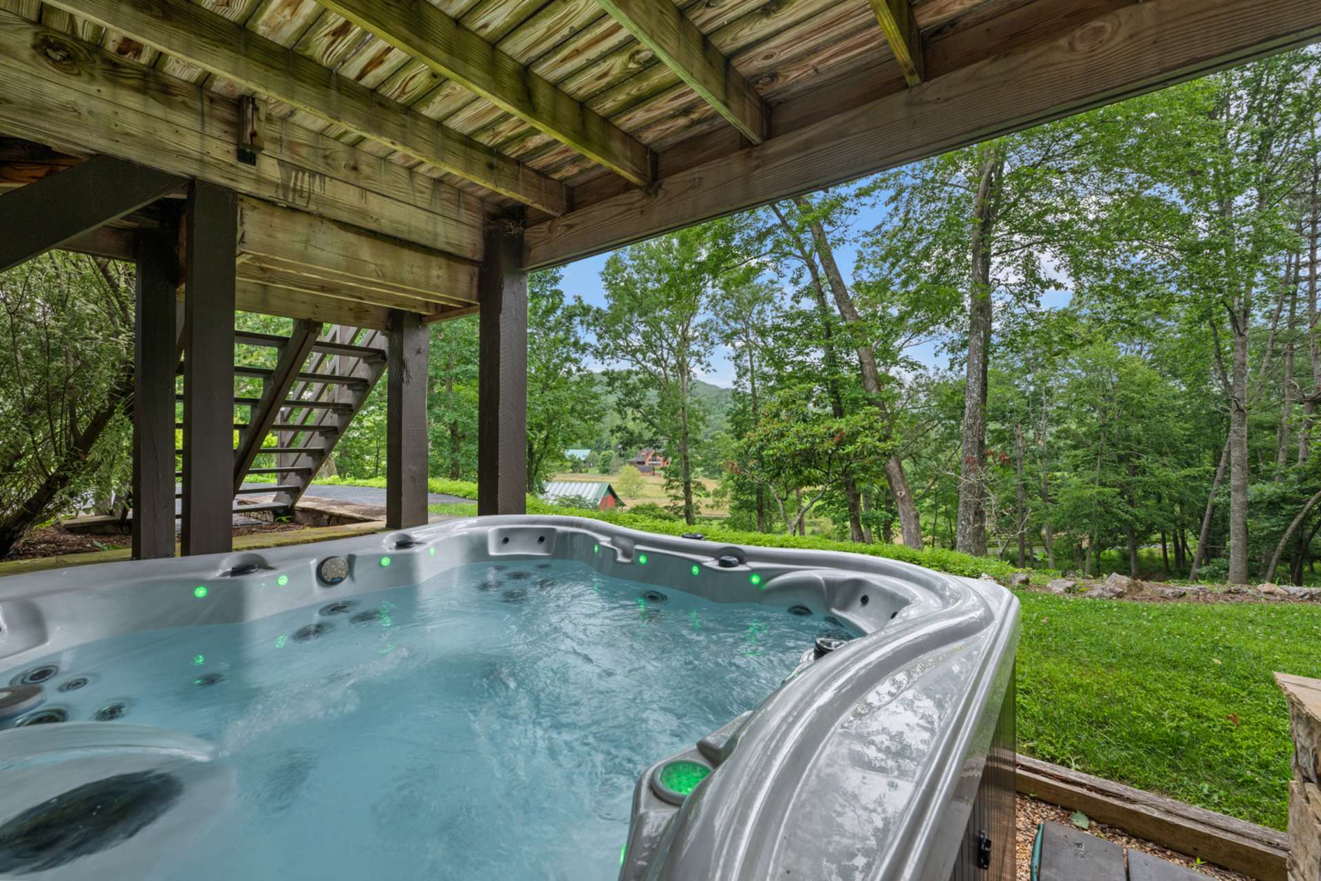 Soak while the fireflies flicker and the night sky unfolds above.