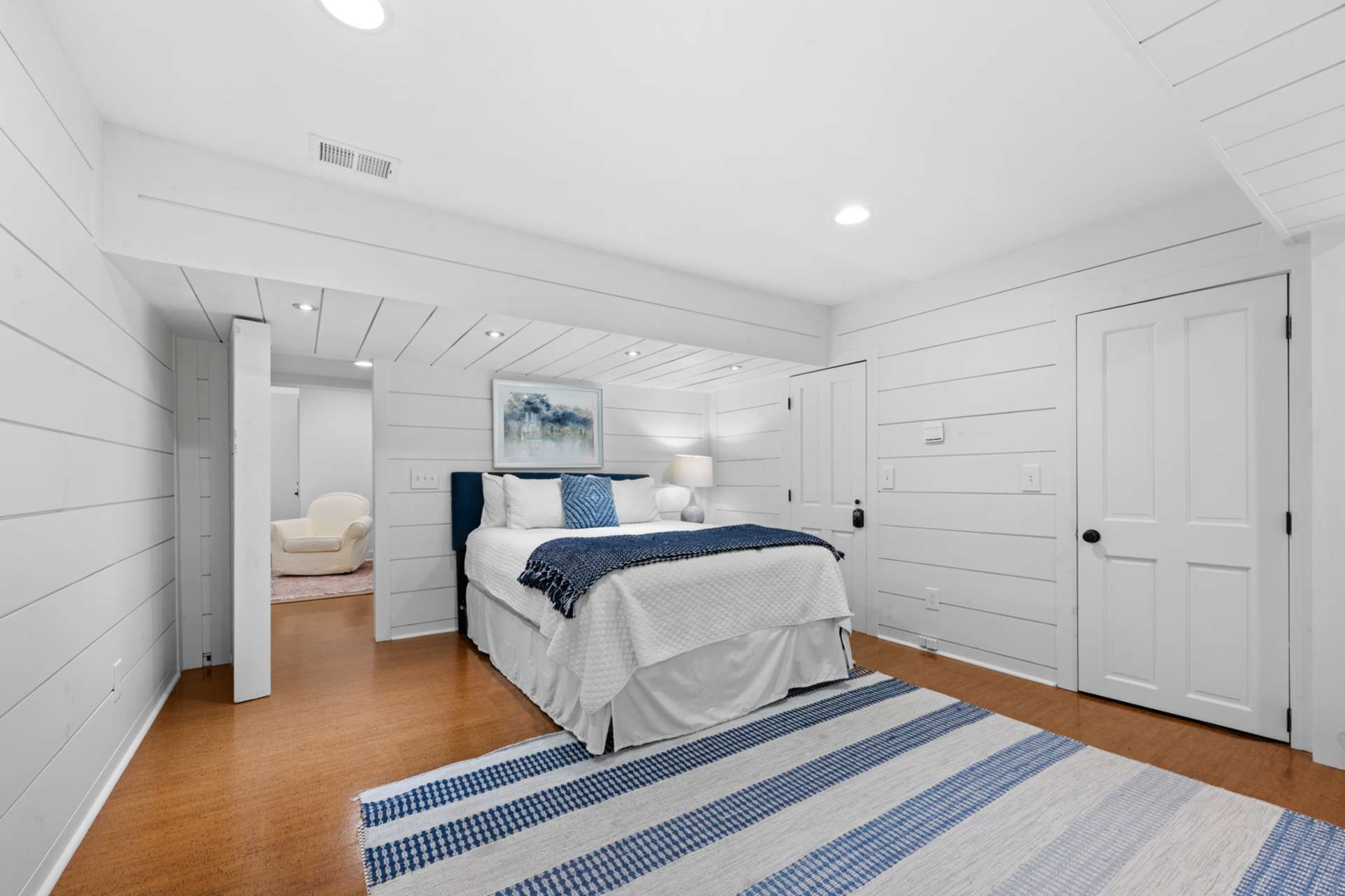 This private bonus room is currently styled as a cozy sleeping space.