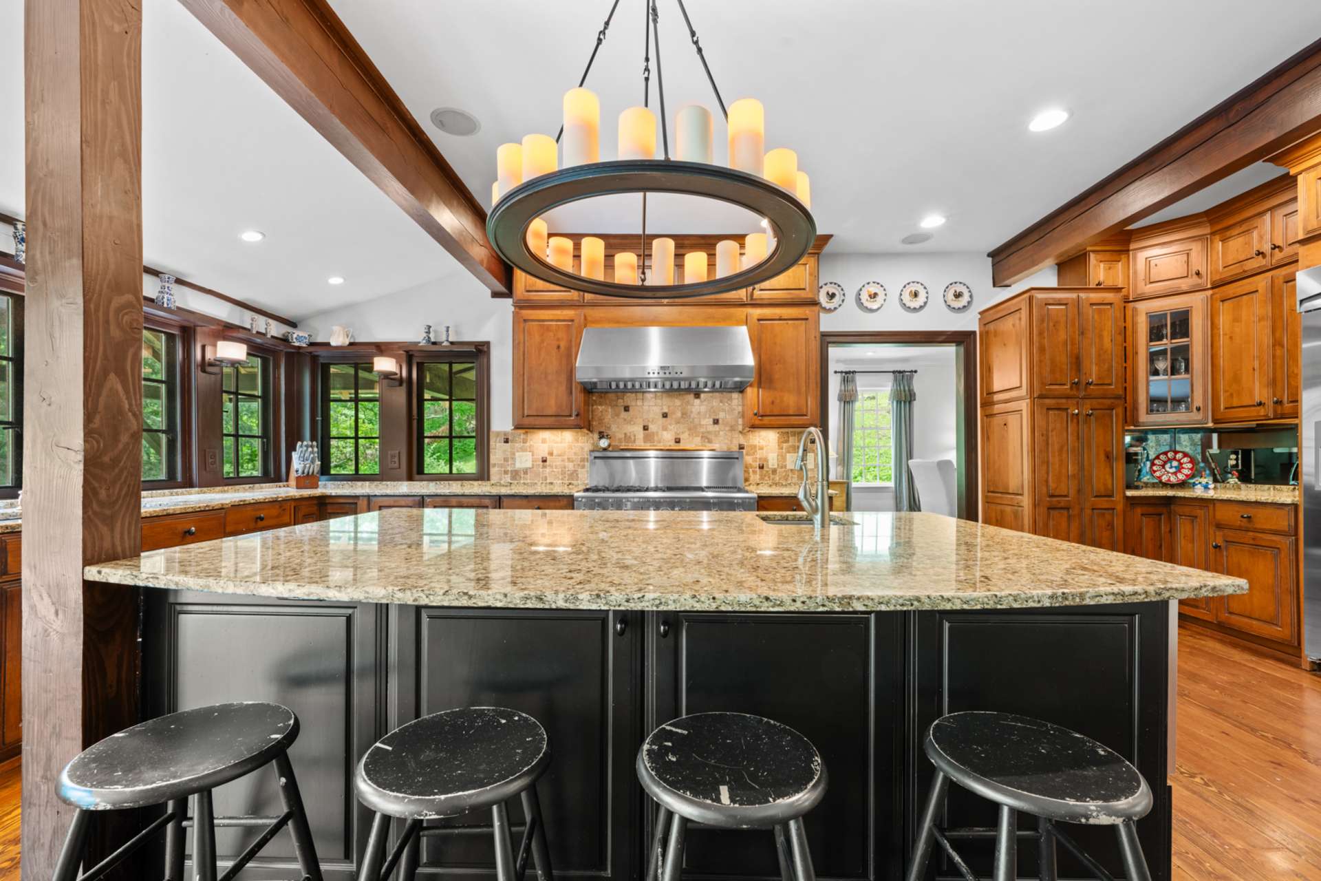 A statement-making island offers generous prep space, bar seating, and a dedicated prep sink.