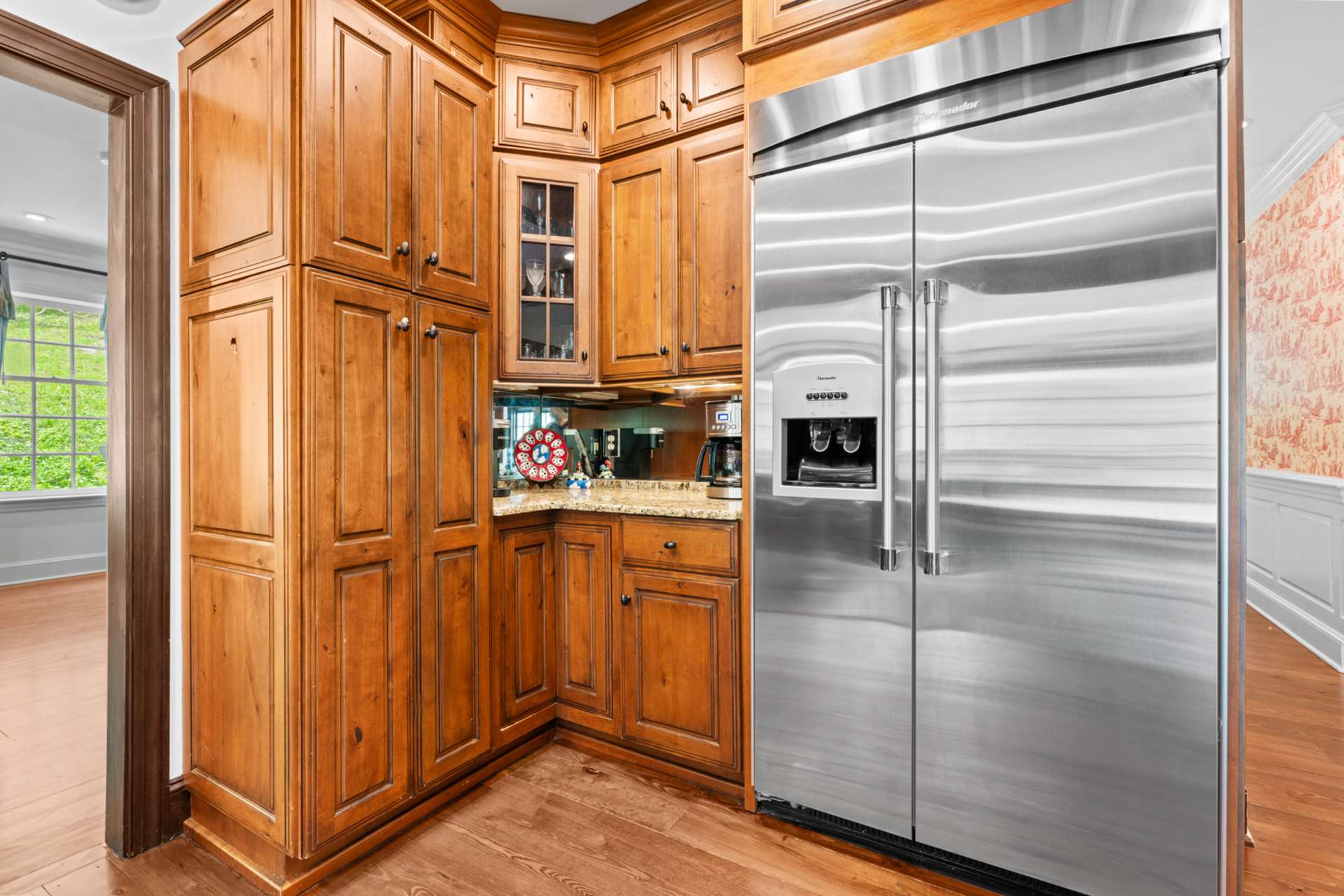Begin your mornings in the cozy coffee nook, with a nearby pantry keeping essentials beautifully out of sight.