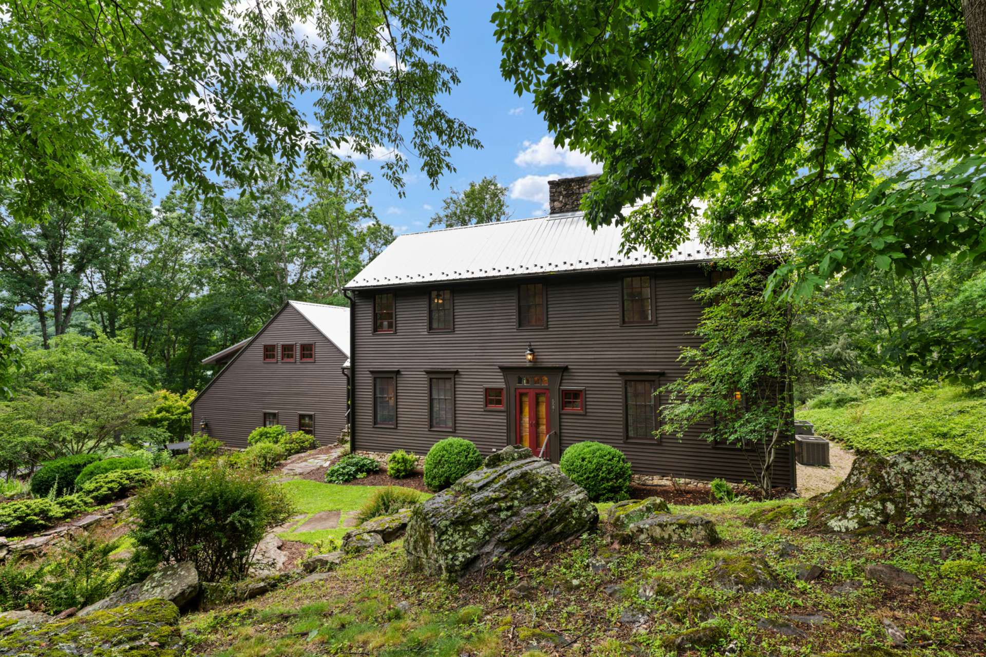 A private hillside setting wrapped in natural beauty with over 6 acres.