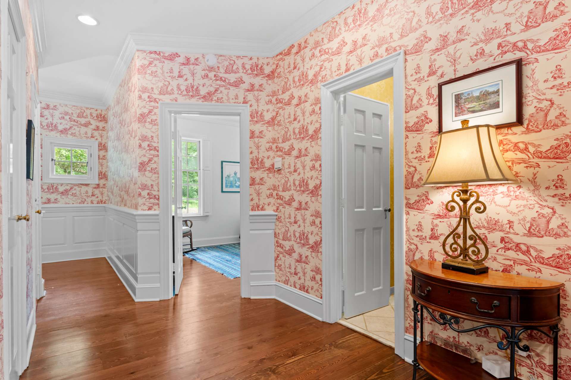 A spacious guest room and full bath are thoughtfully positioned just beyond the kitchen—ideal for overnight visitors.