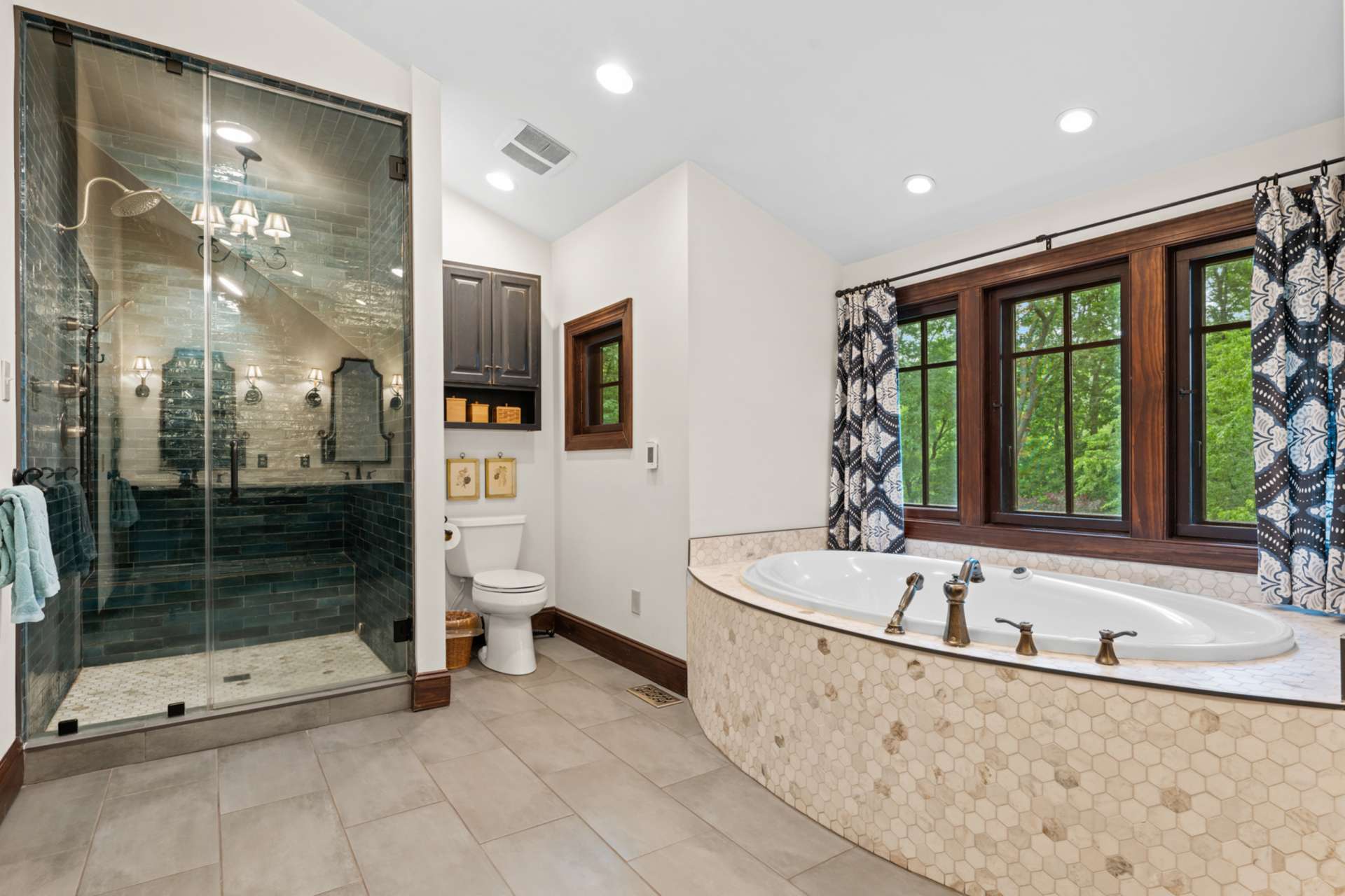 This beautiful tiled steam shower is big enough for two.