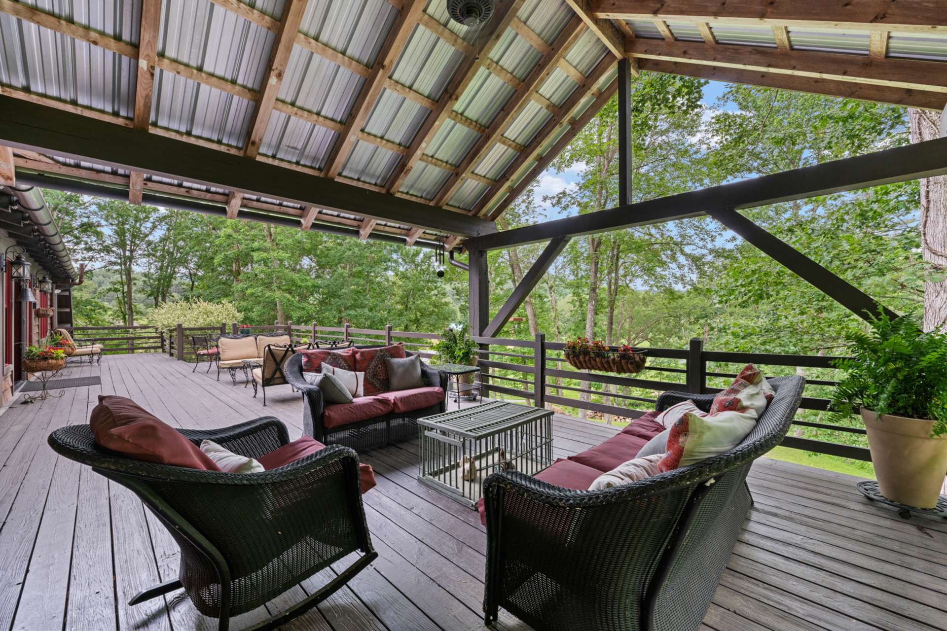 From dinner to drinks, the dining and sitting rooms extend naturally to a covered deck designed for open-air gatherings.