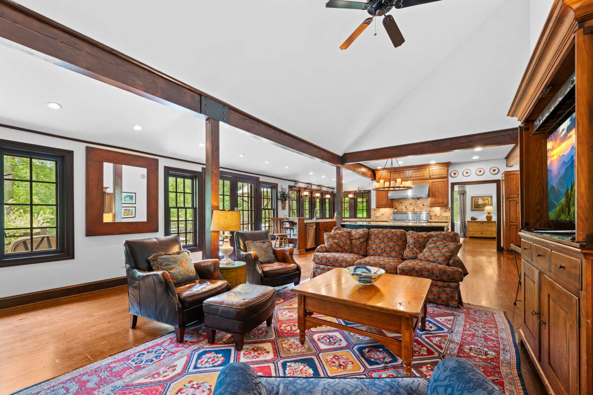 French doors reveal a generous rear deck where gatherings move easily between indoors and out.