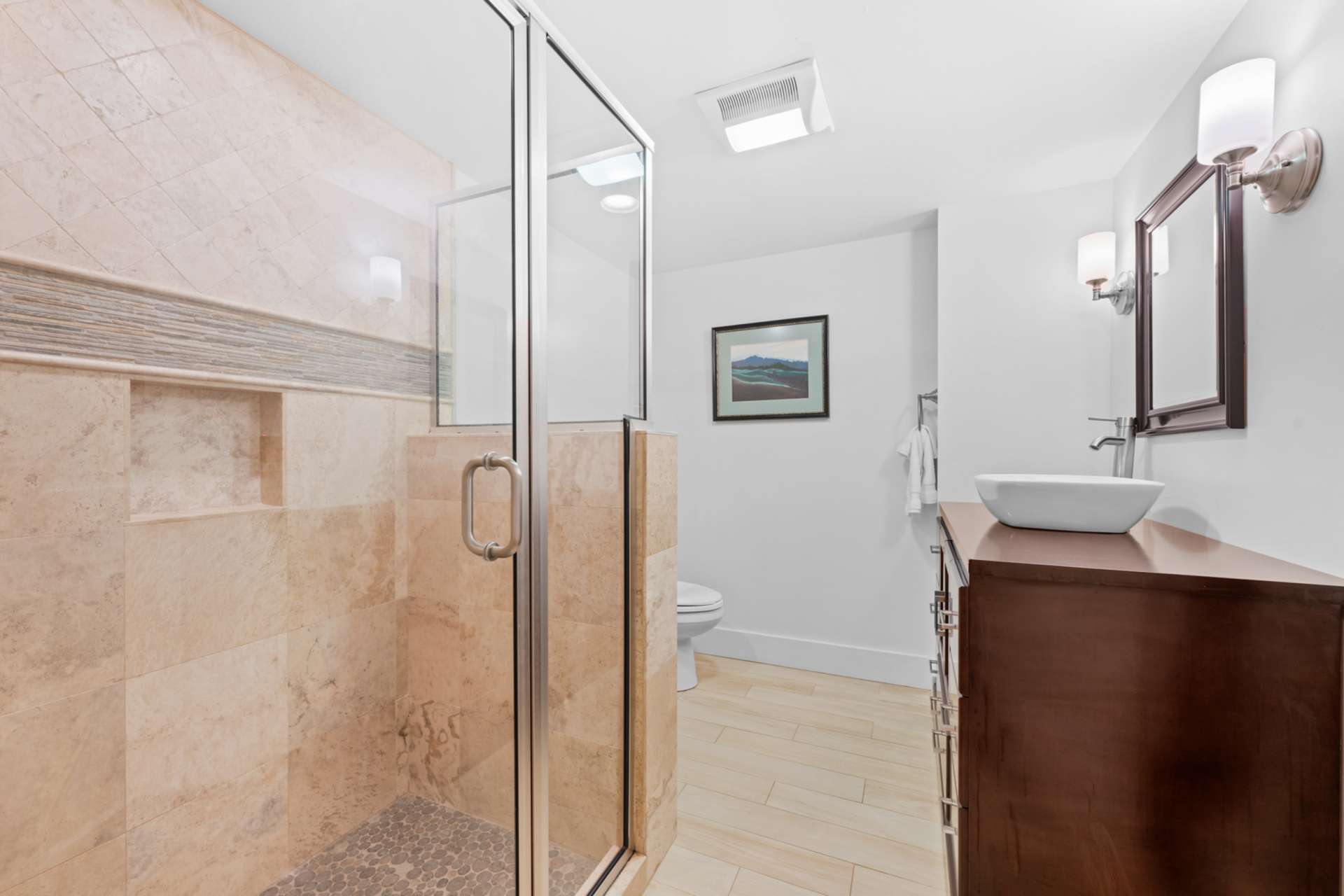 The lower-level full bath ensures comfort and ease for all who gather downstairs.