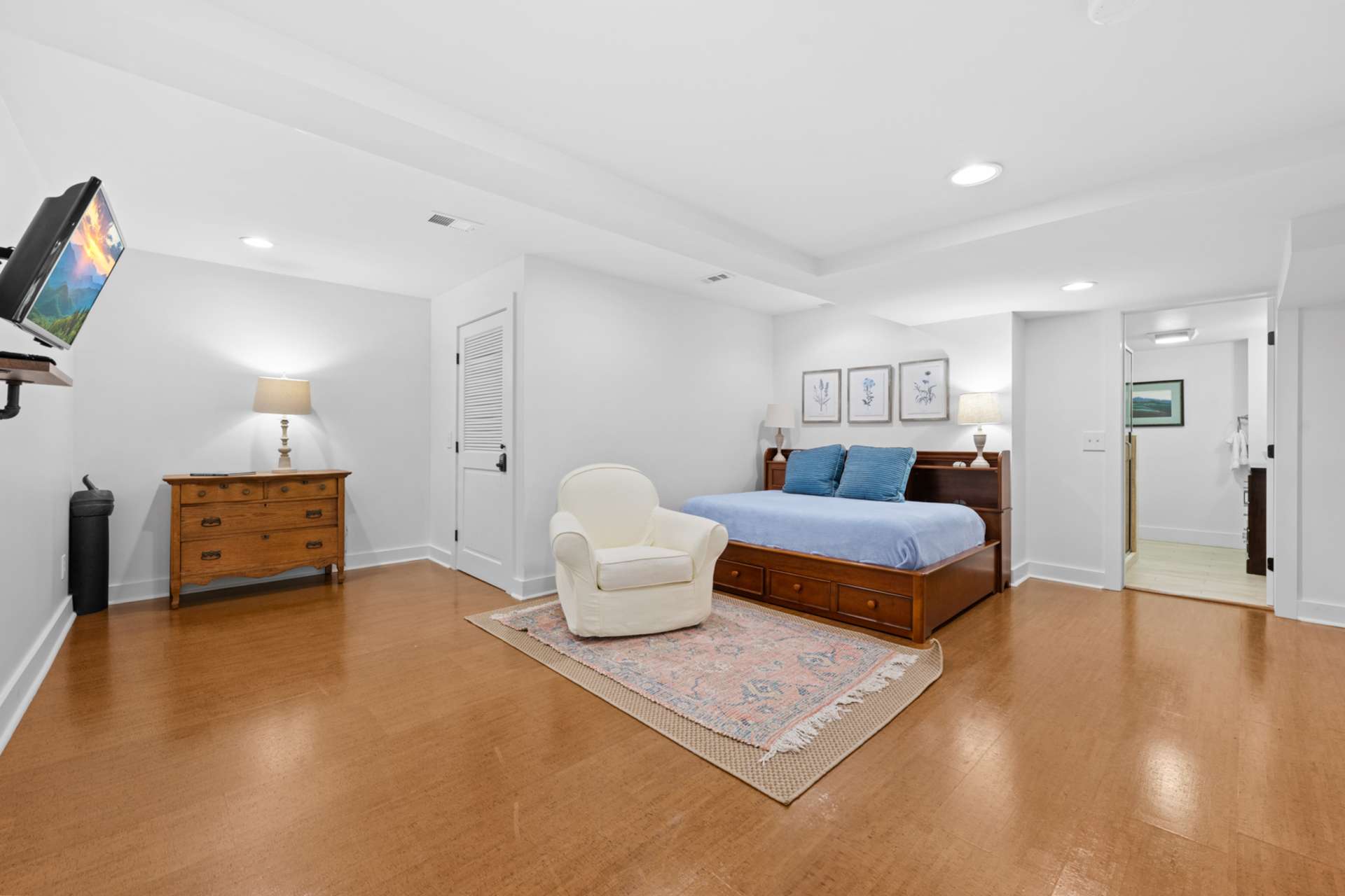 A second versatile bonus room opens to the family room and is currently arranged for overflow guests.