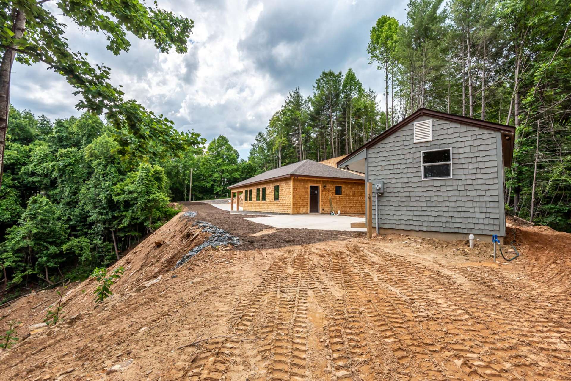 There is a concrete patio that joins the guest quarters and the main home.