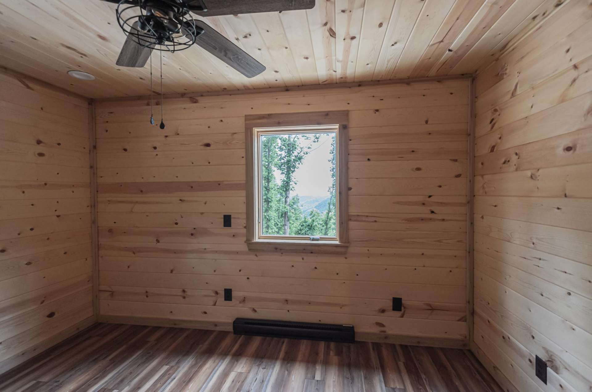 The master bedroom features a private master bath and access to the patio shared by guest cabin.