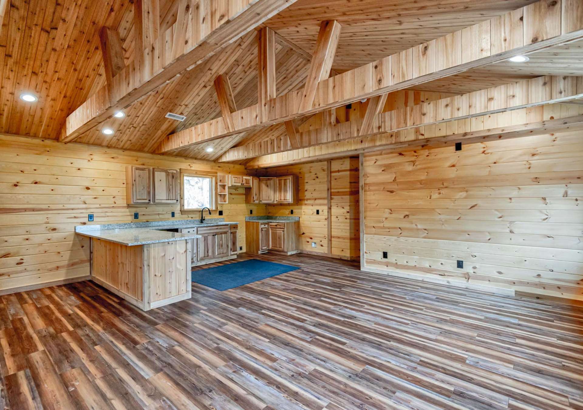 The cabin is quality built with many custom details including cedar ceilings and cedar exposed beams both inside and out as well as cedar shake siding.