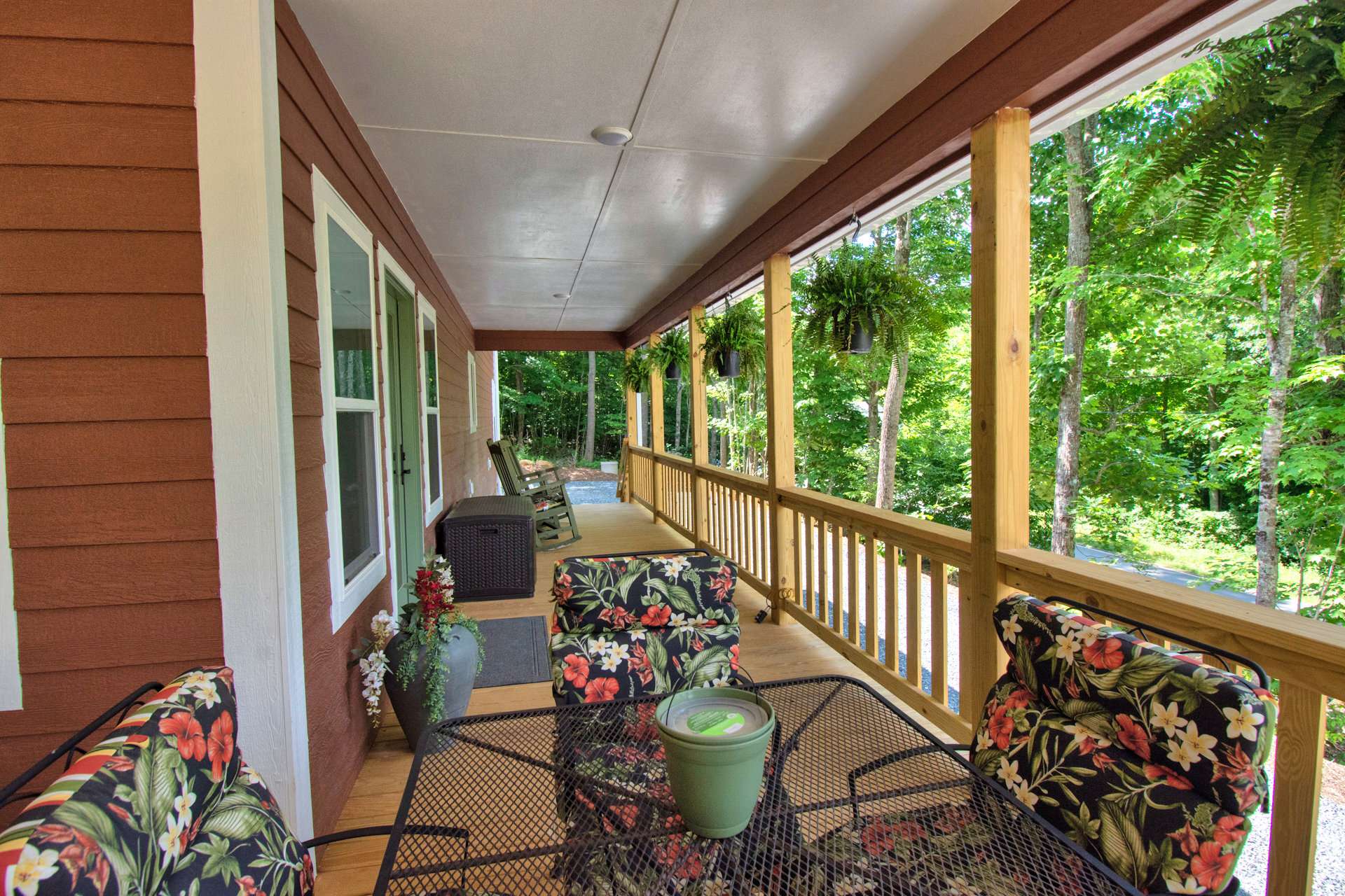 A wrap around covered porch gives this like-new 3-bedroom, 2.5-bath Southern Ashe County home a farmhouse look.  You will love spending time outdoors and entertaining during the warmer months.