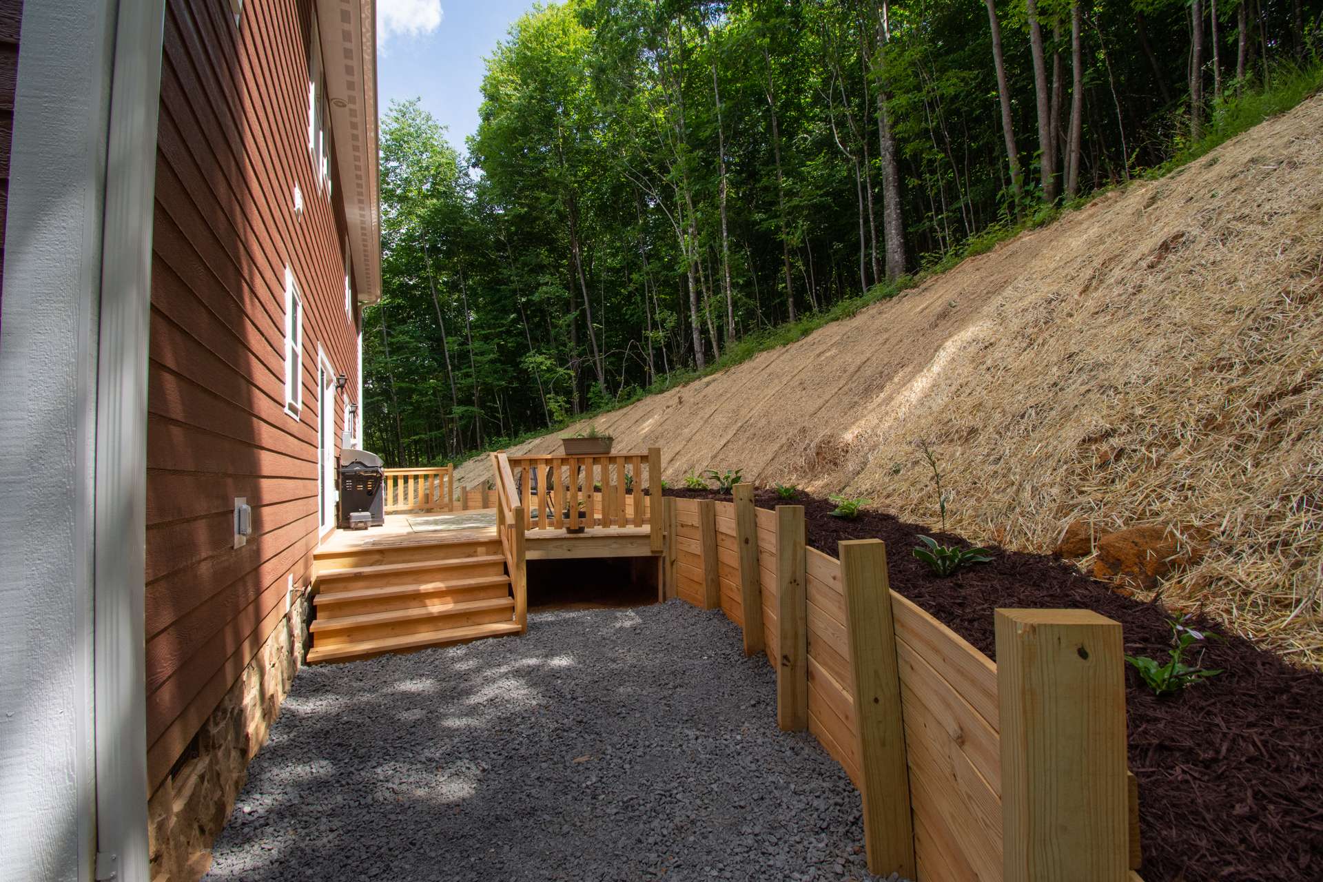 In addition to the front covered porch, this open back deck expands the outdoor entertaining options.