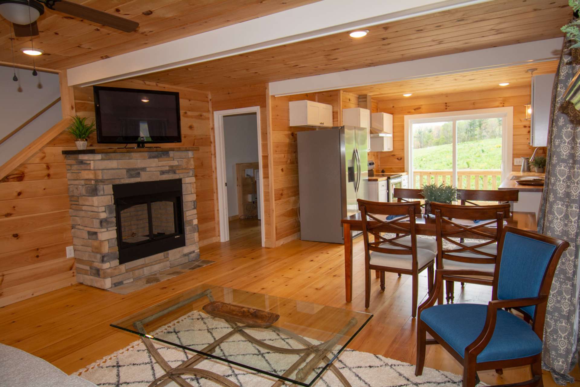 Entering front door into living area looking toward dining & kitchen.