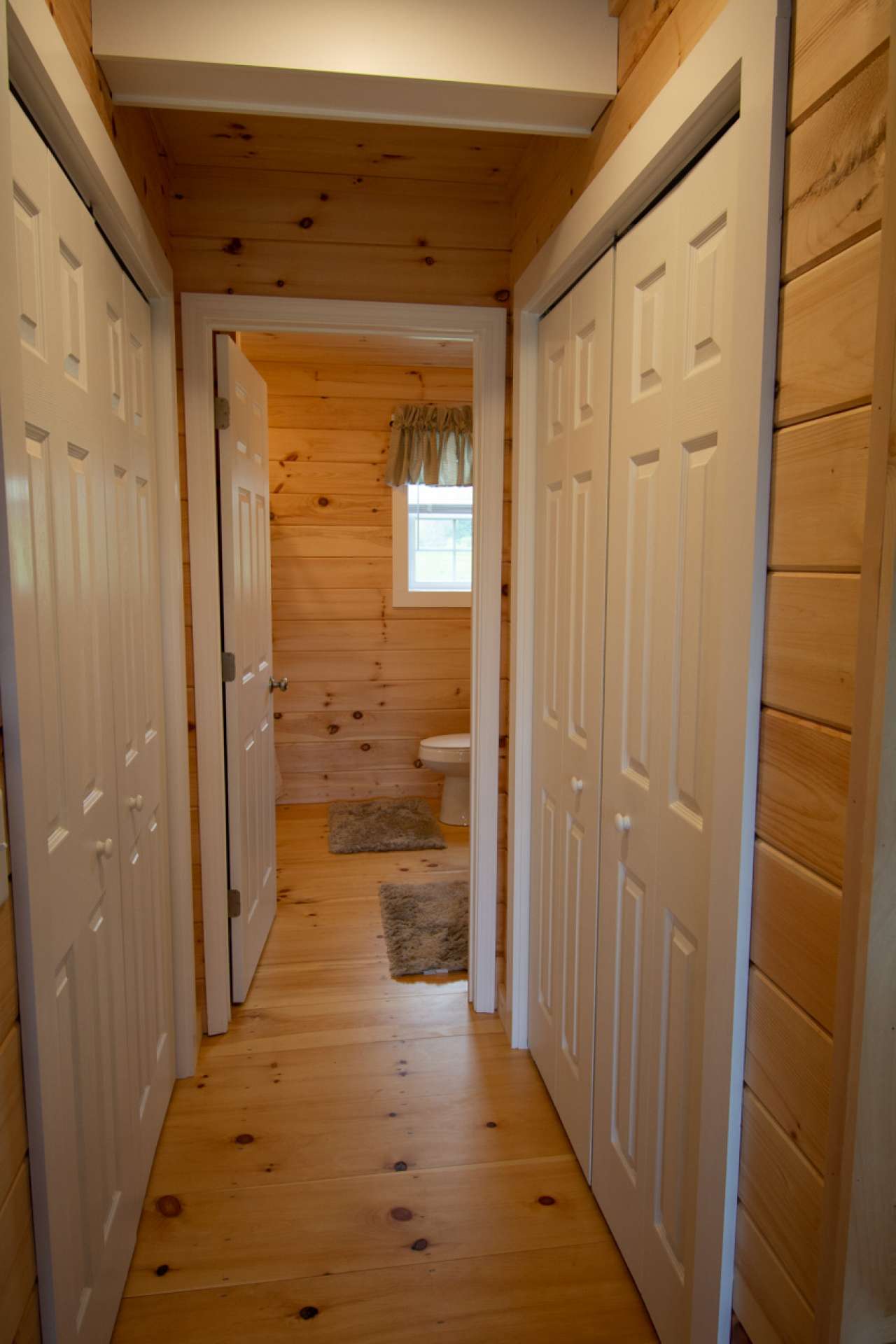 Second level bathroom with closets on each side as you enter.