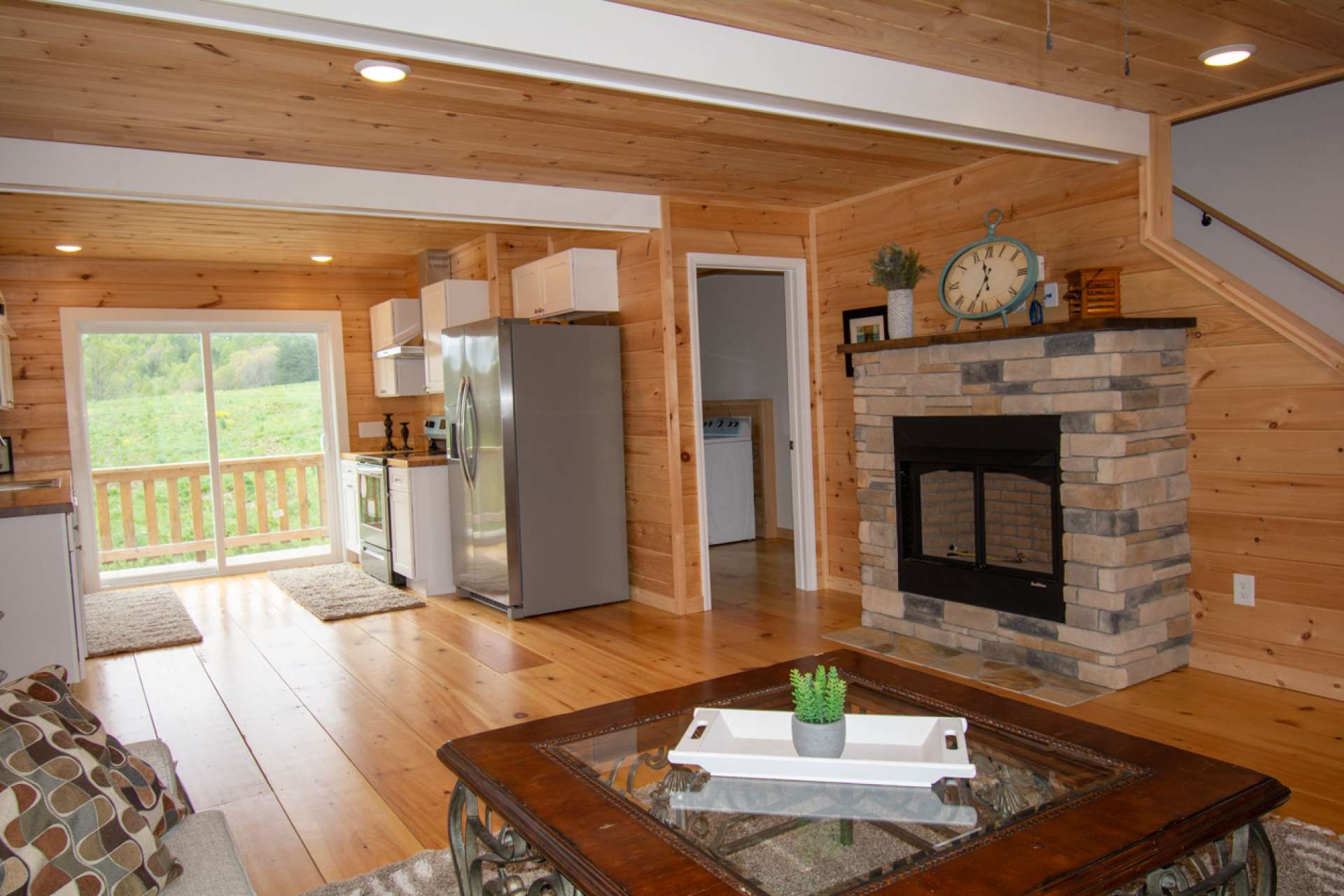 Entering front door into living area looking toward dining & kitchen.