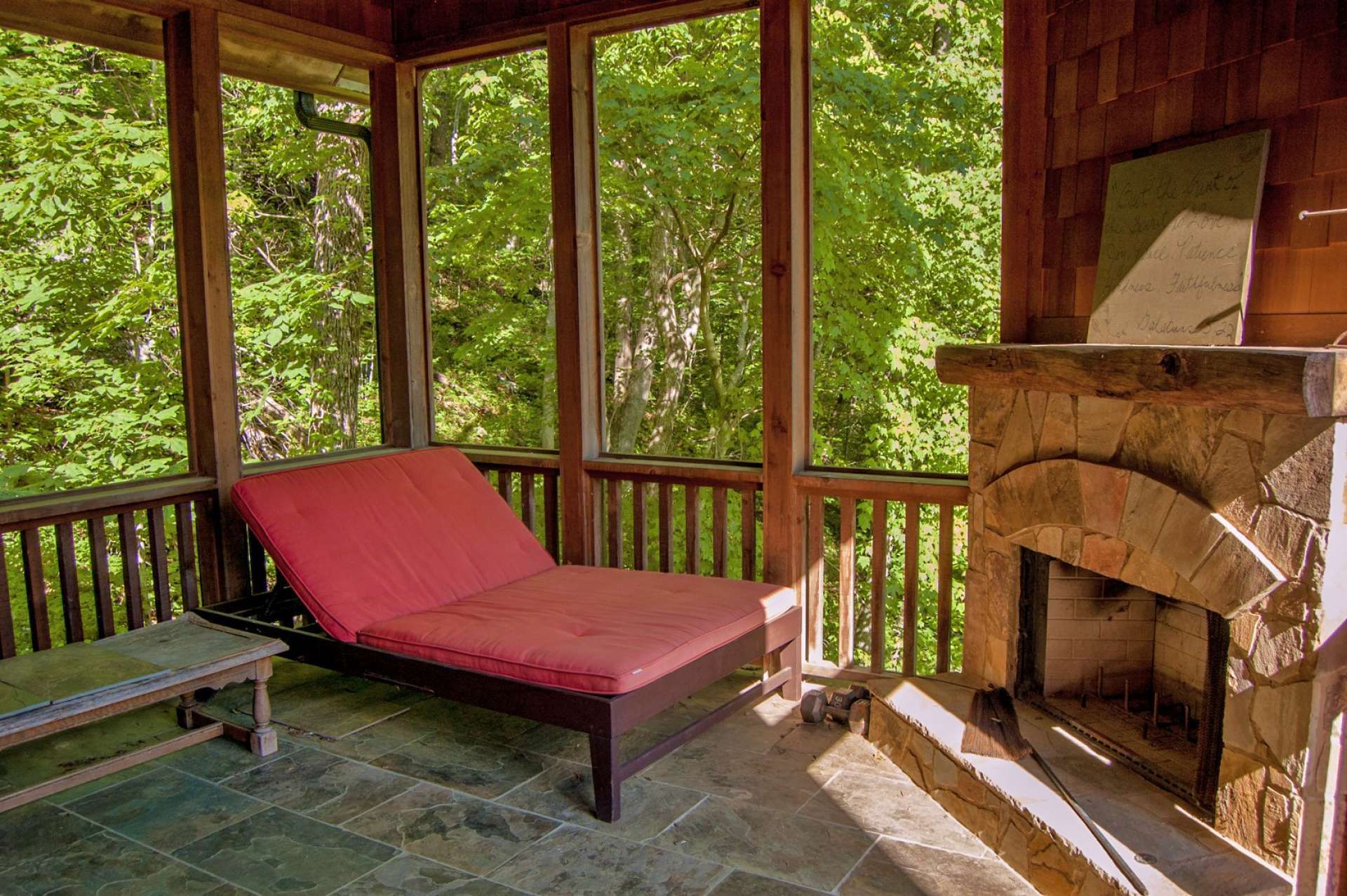 Just off the master bedroom, this private covered porch is the perfect spot to relax at the end of the day in front of the outdoor fireplace.