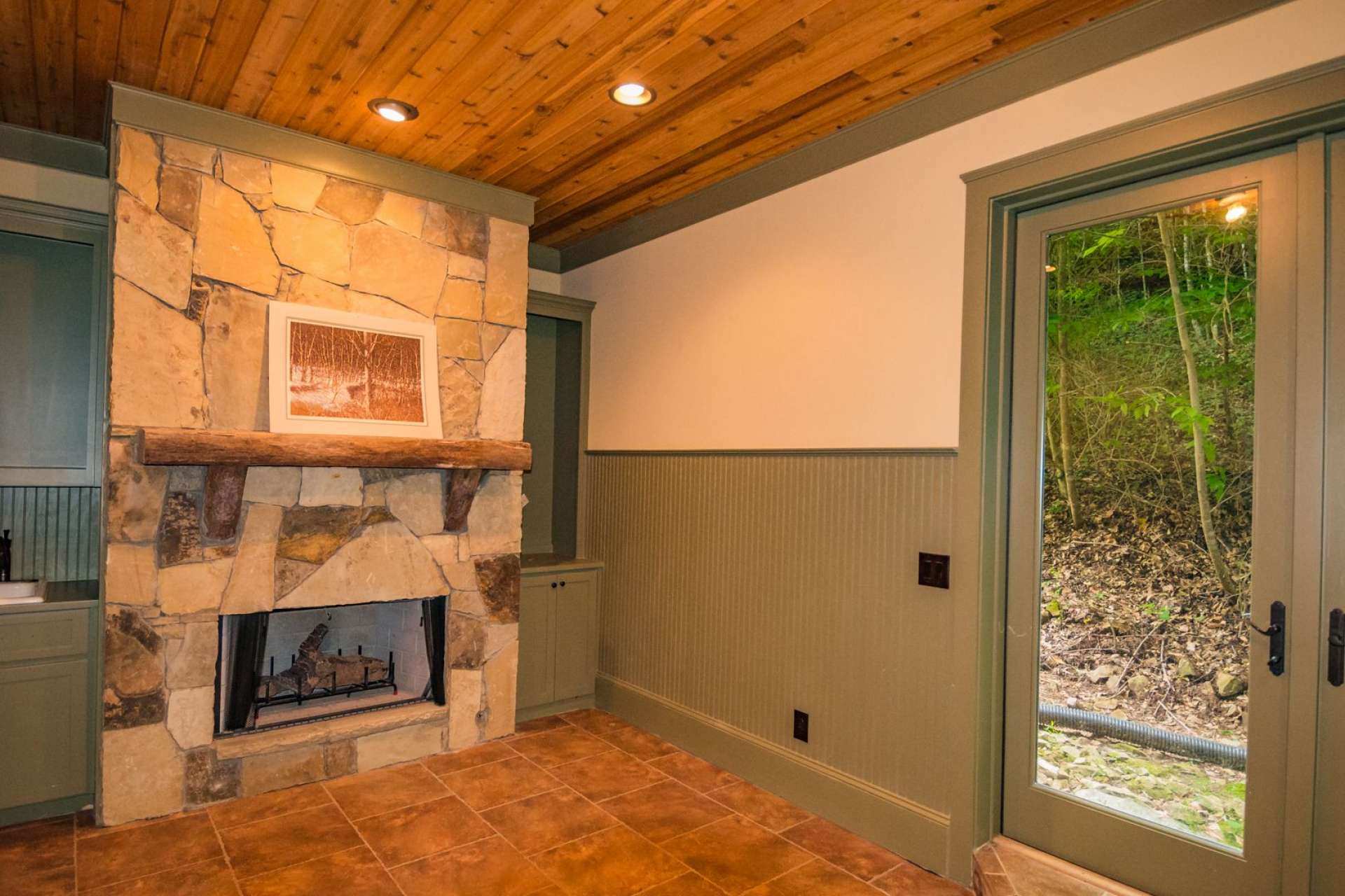 In the master suite wing, you will find this bonus room with fireplace and built-in cabinets that current owners used as a studio. You can utilize this space for any number of uses.