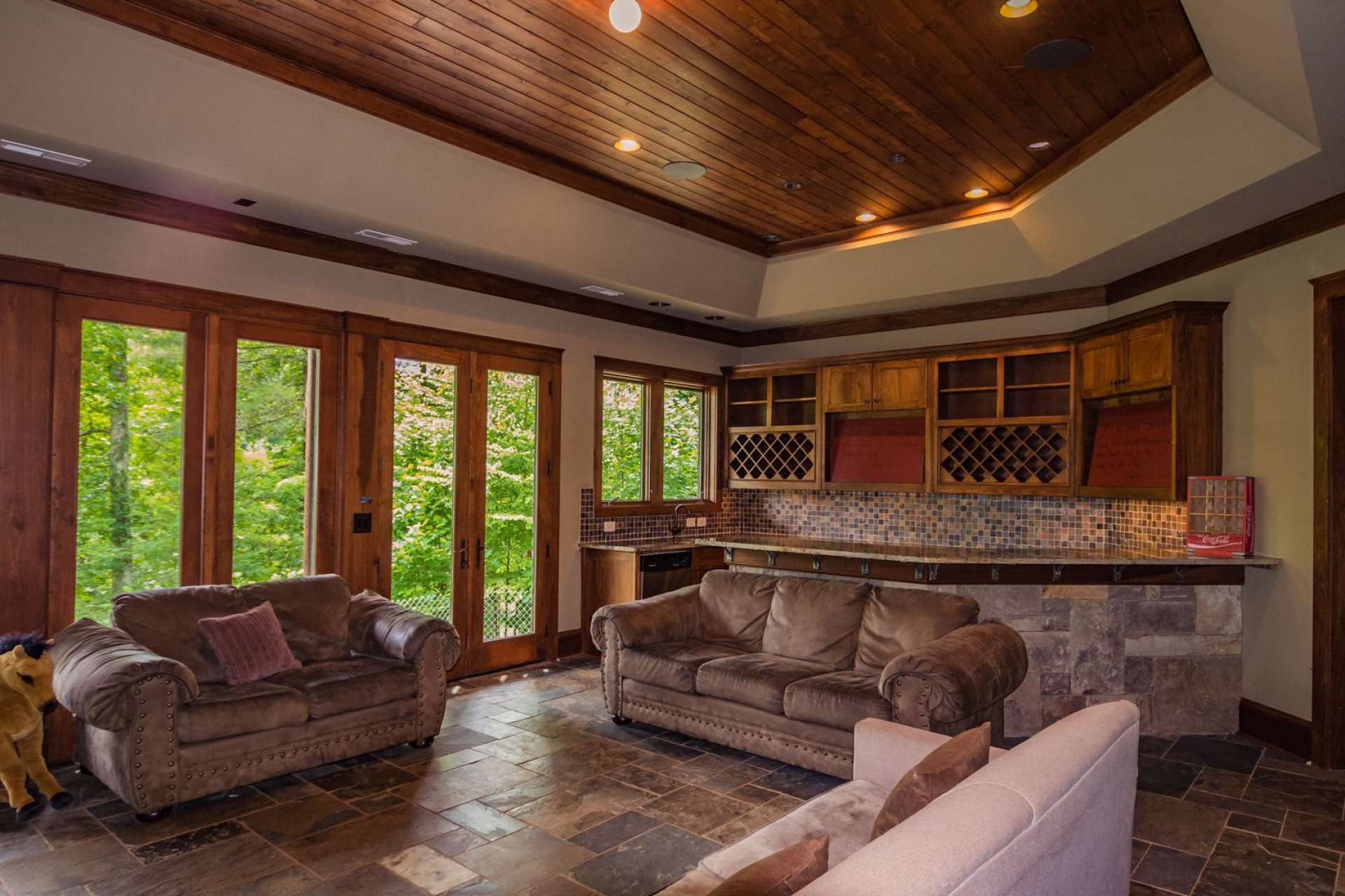 The great room windows also provide passive solar heat gain, and offer views of the river below.