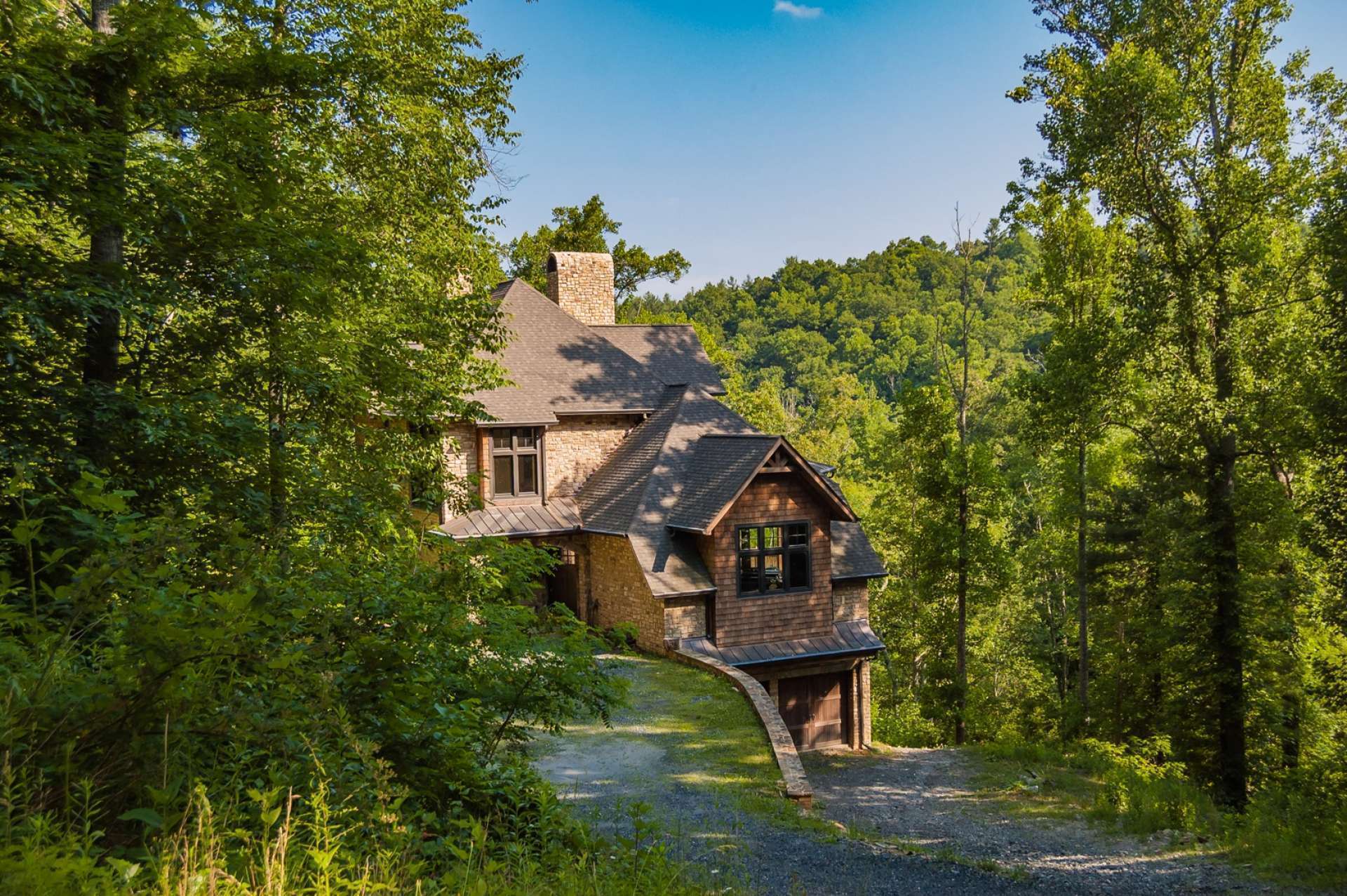 Accessed from a private graveled drive, this 4-bedroom, 5.5-bath contractor's home offers many unique and custom details.