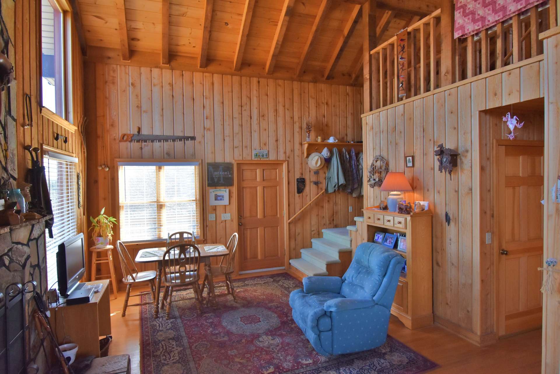 Notice the dining area is placed to take advantage of the outdoor scenery via the large windows when dining indoors.