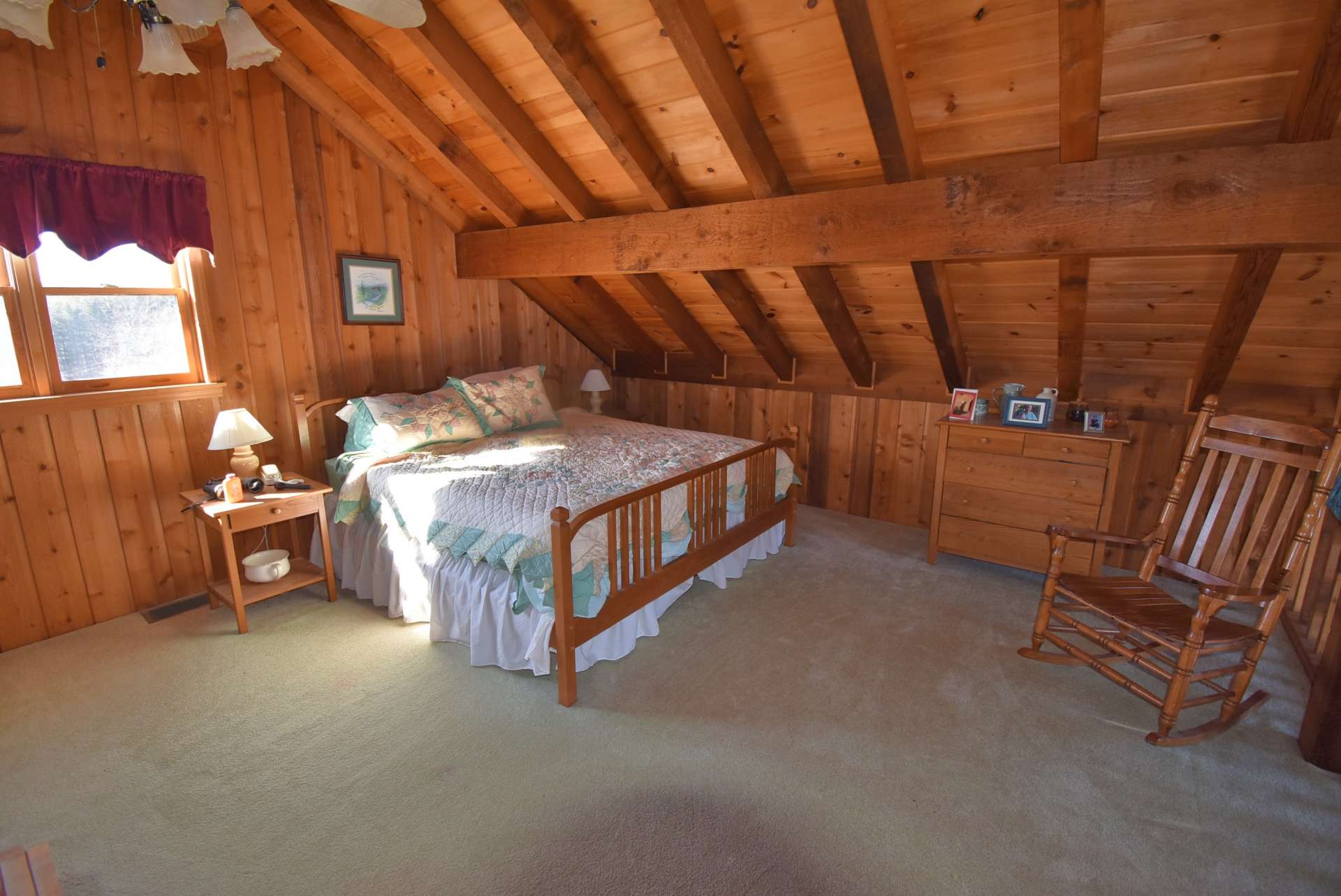 The upper level offers an open loft area overlooking the great room and is home to the second bedroom space.