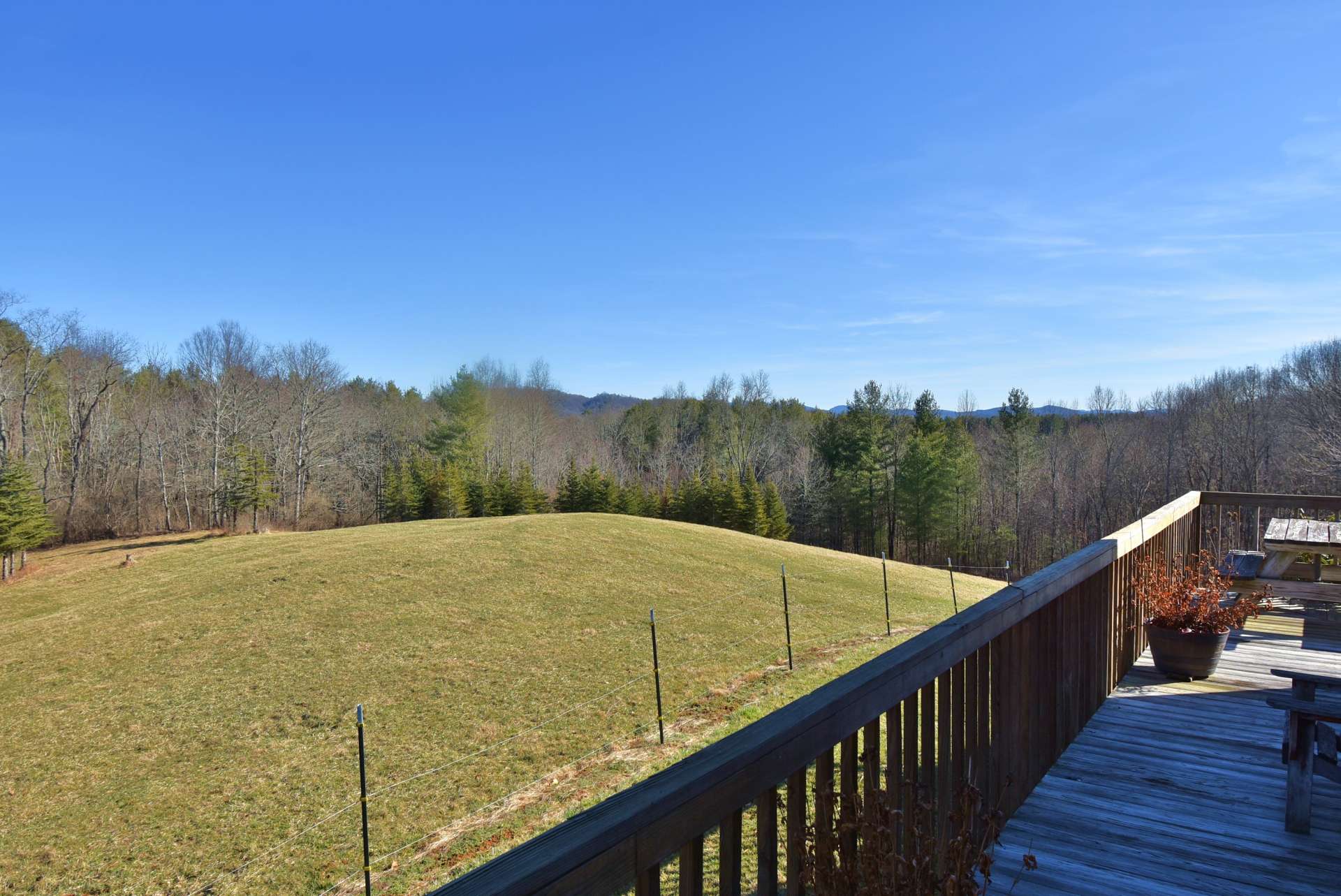 Located on a country road in the Grassy Creek area of Northeastern Ashe County, this secluded property is just a hop and a skip away from the historic New River and convenient to Jefferson, West Jefferson, and the Grayson Highlands areas.
