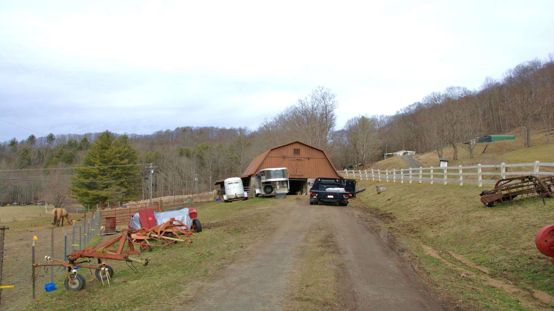 Two spacious barns offer storage for equipment or farm animals.