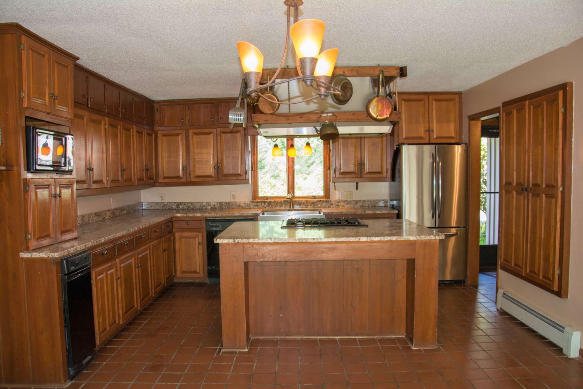 Notice all of the work and storage space in the kitchen.