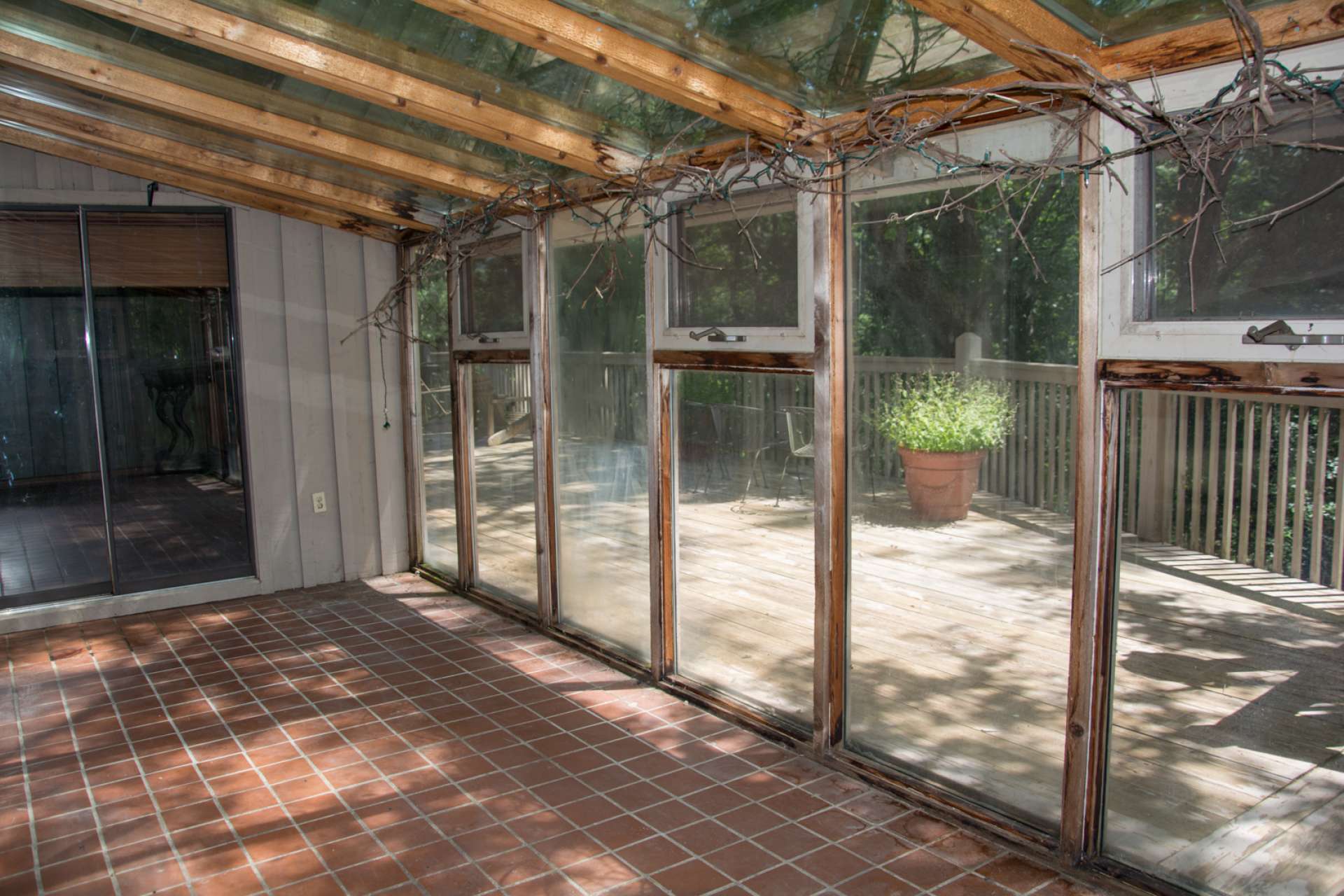 Accessed from the informal dining area, this sweet sunroom is perfect for dining and still enjoying the outdoors during the cooler months. What a great place for your plants!