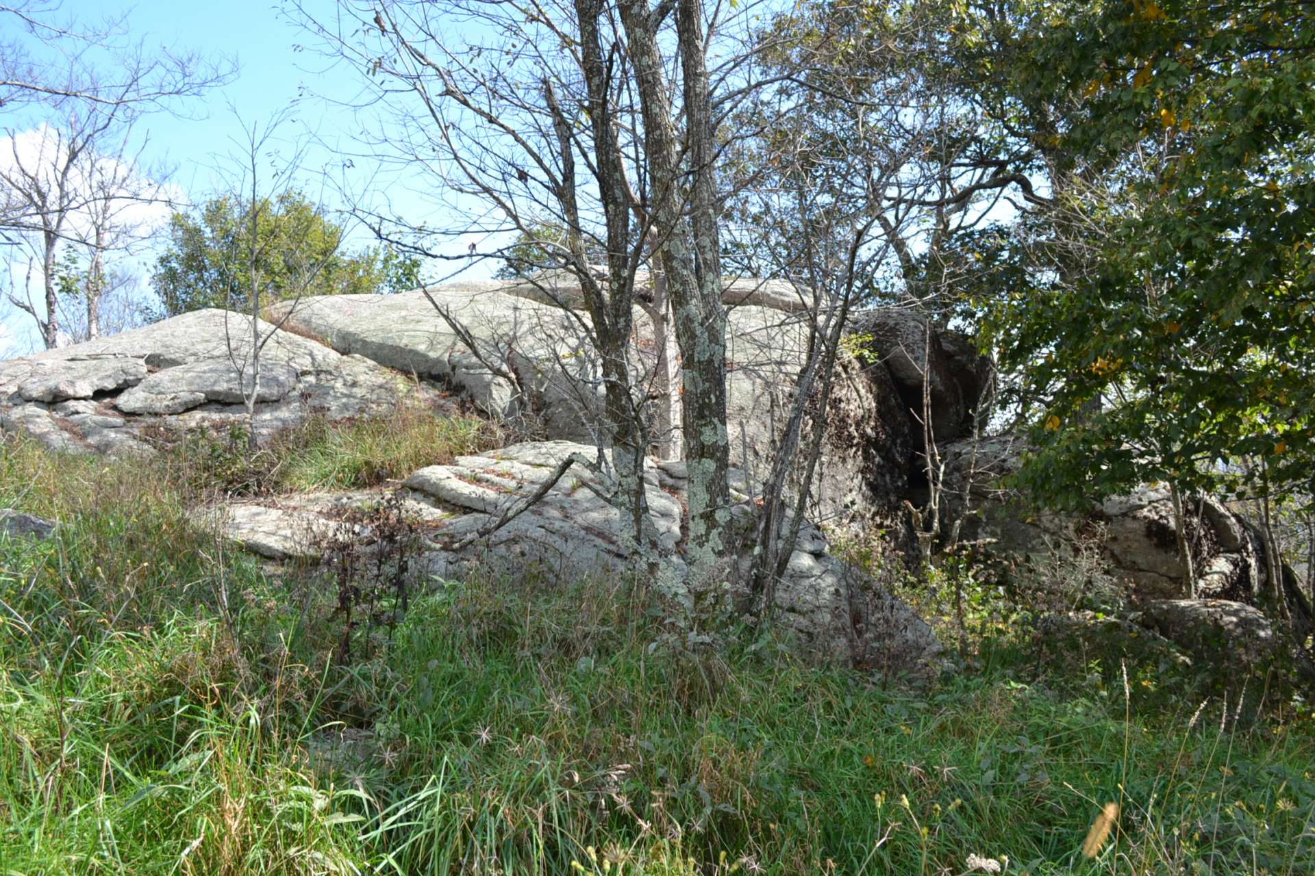 Unique rock formations and exposed boulders provide natural landscaping accents.