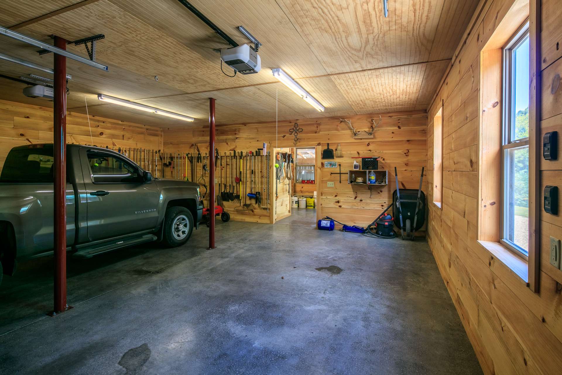 Not only does the garage offer plenty of space for vehicles, it also features a nice workshop area.