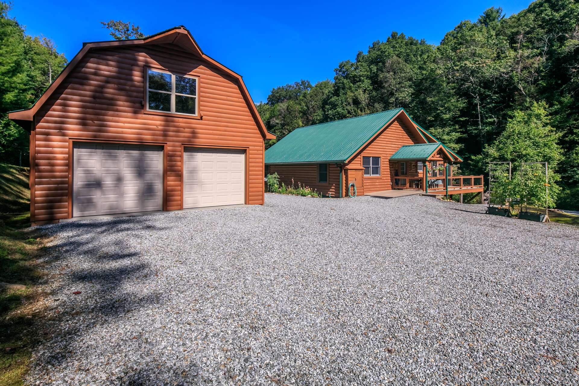 Notice the abundant parking space and detached 2-car garage.