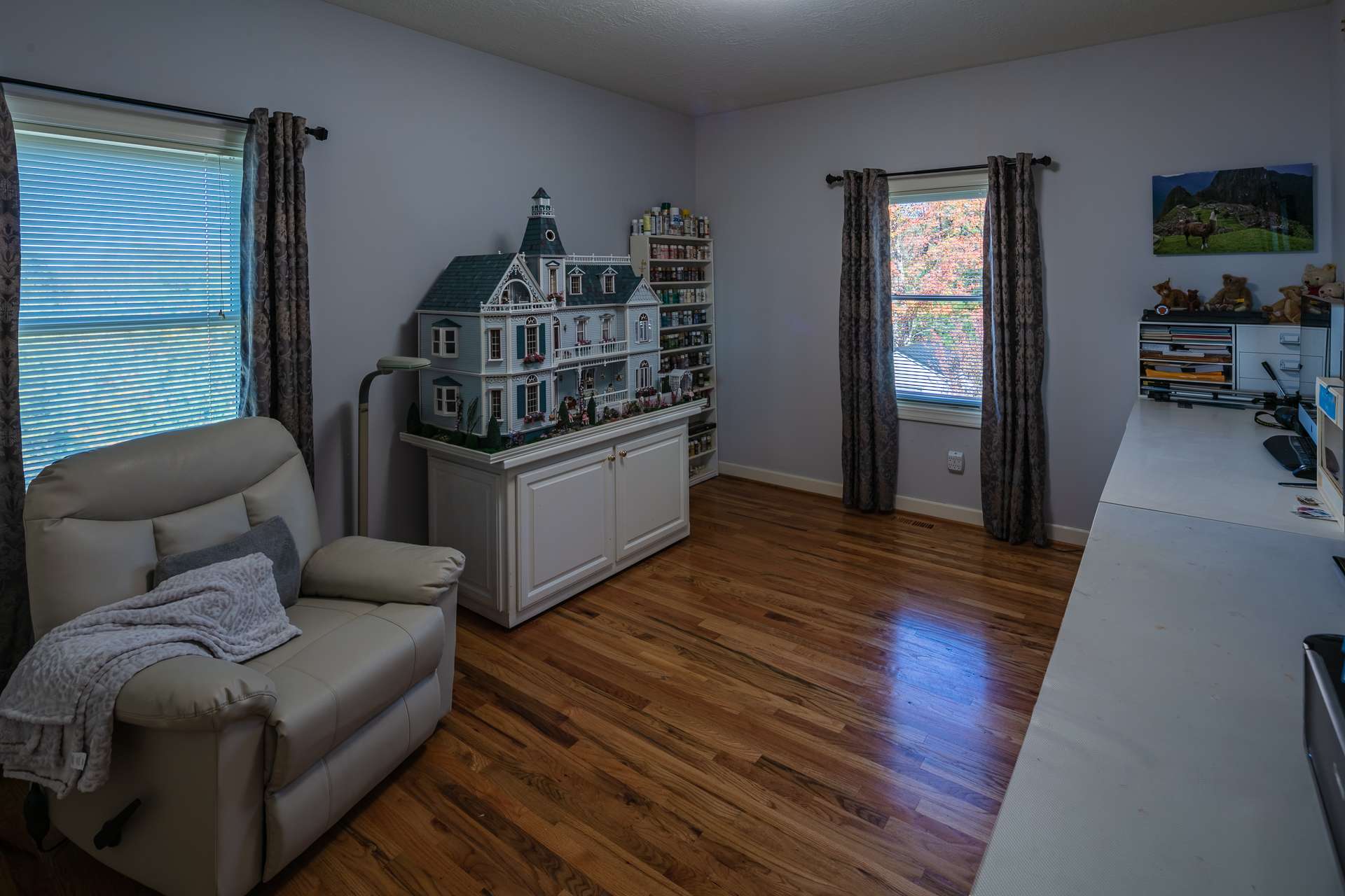 The main level offers a nicely sized bedroom with wood floors and a private bath.  This could be an option for the master suite.  The current owners use this space for artistry and creativity.