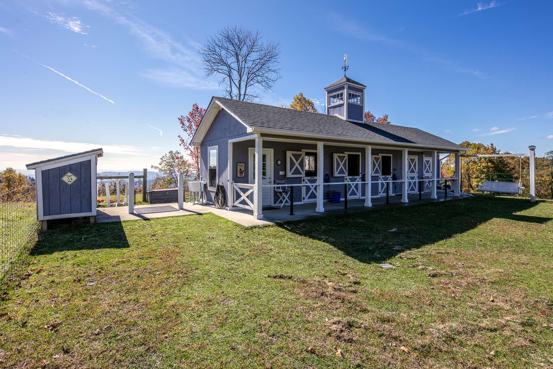 Also included is this 5 stall horse barn with hay storage and wash area that includes hot water.