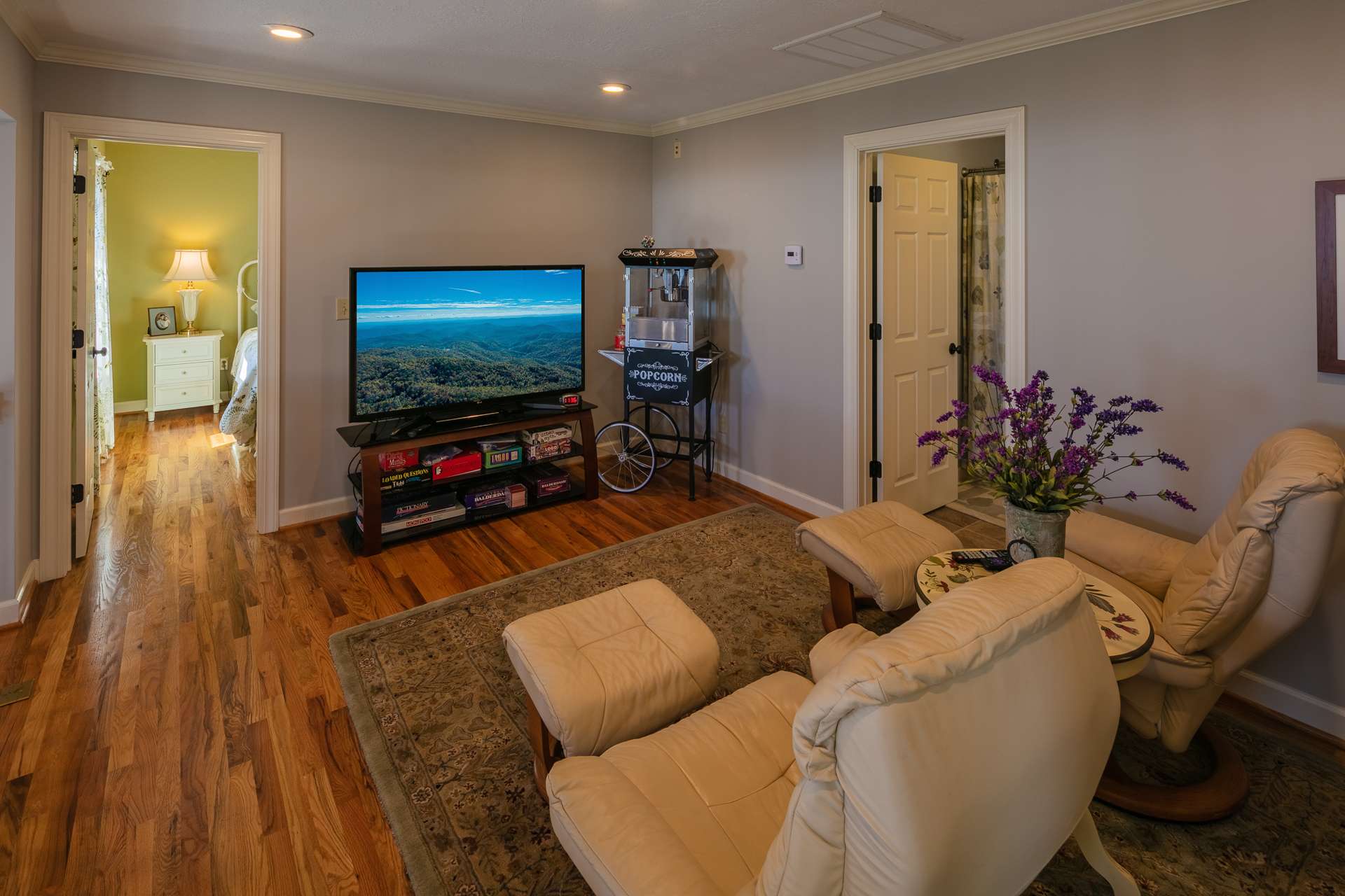 On the upper level, this open loft area overlooks the great room and offers a great space for library, or sitting area.