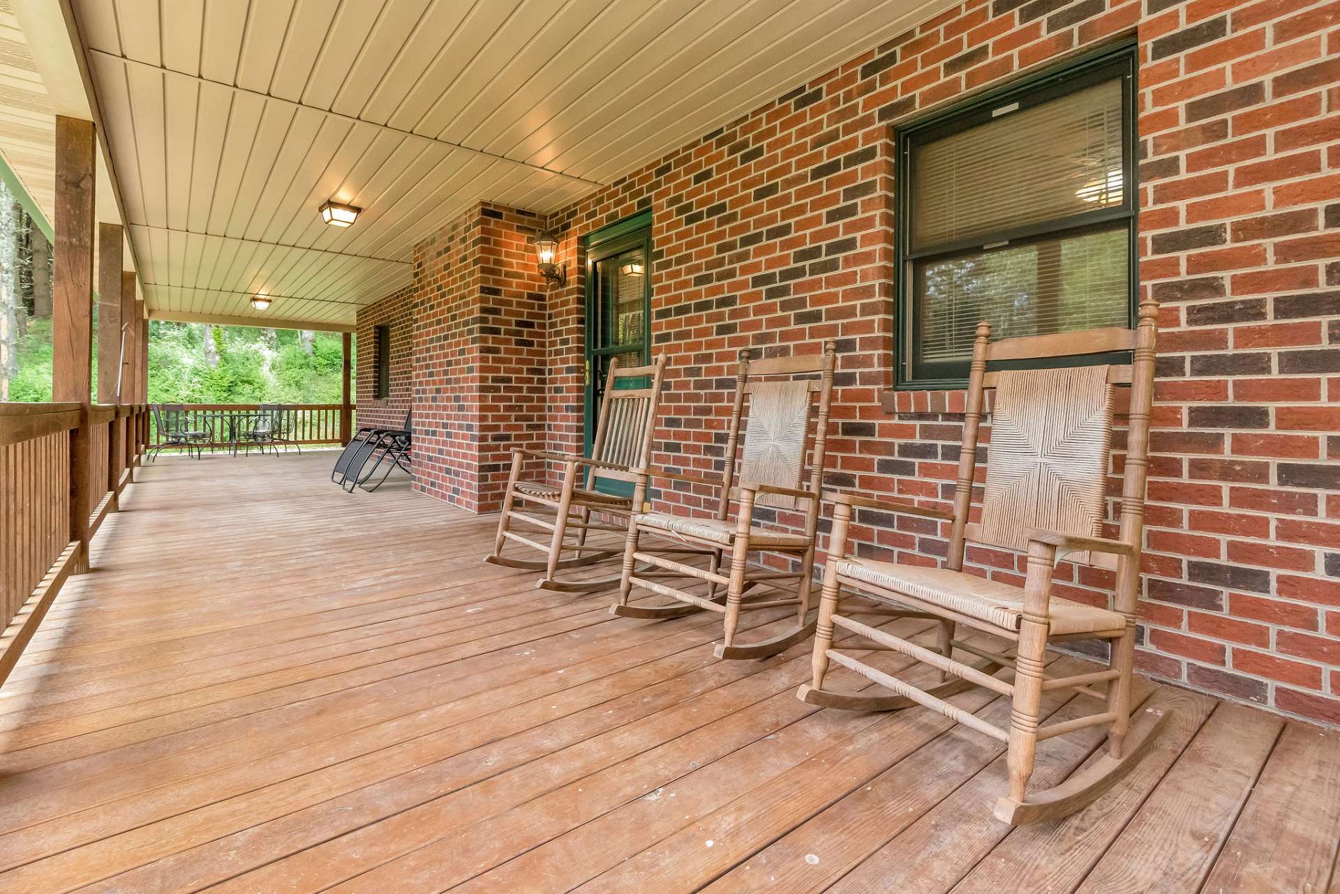 The wrap-around covered porch wraps around all four sides of the home providing access to and from the kitchen and living area, as well as both bedrooms.