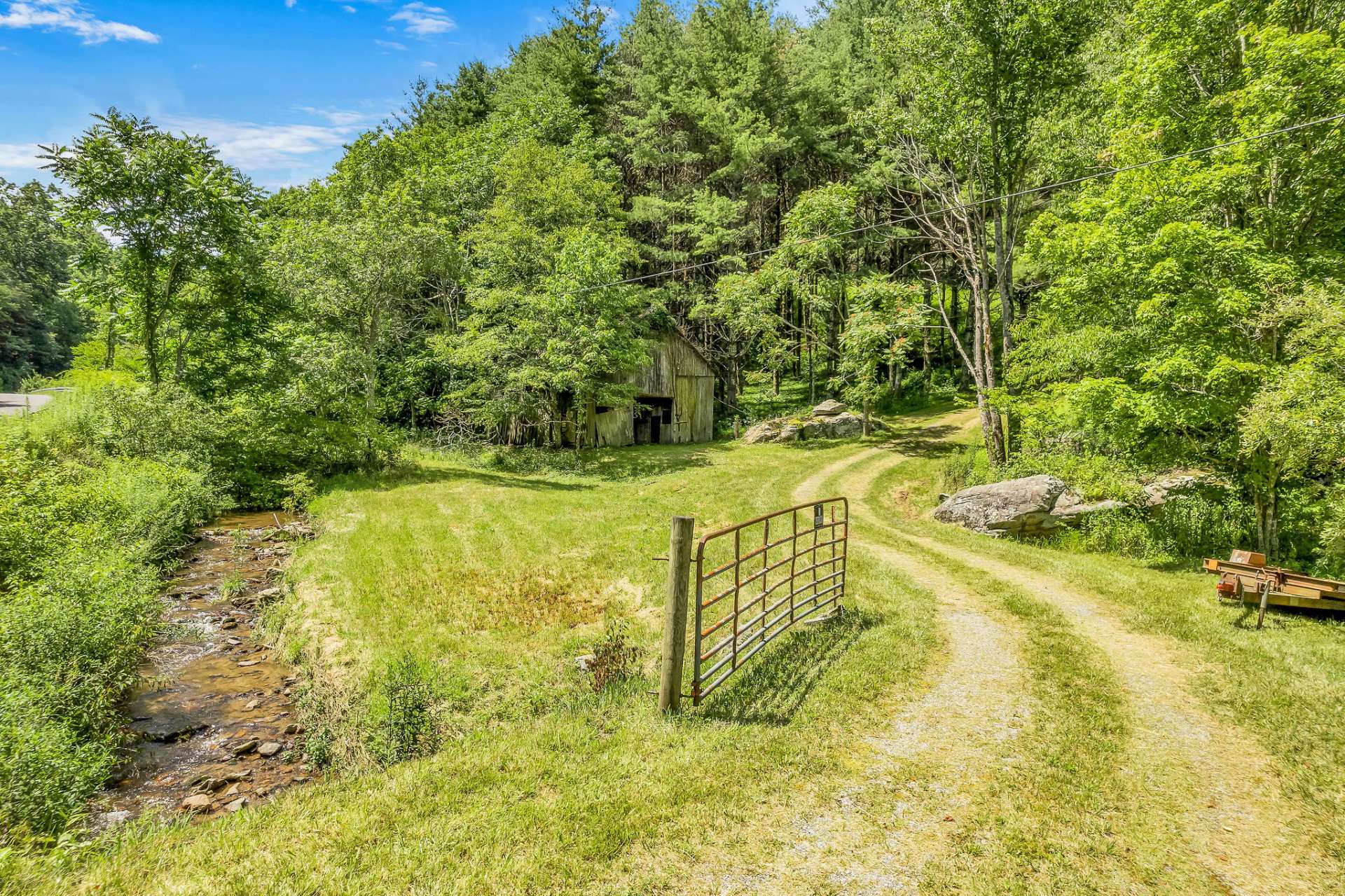 Private entrance from state-maintained paved road.