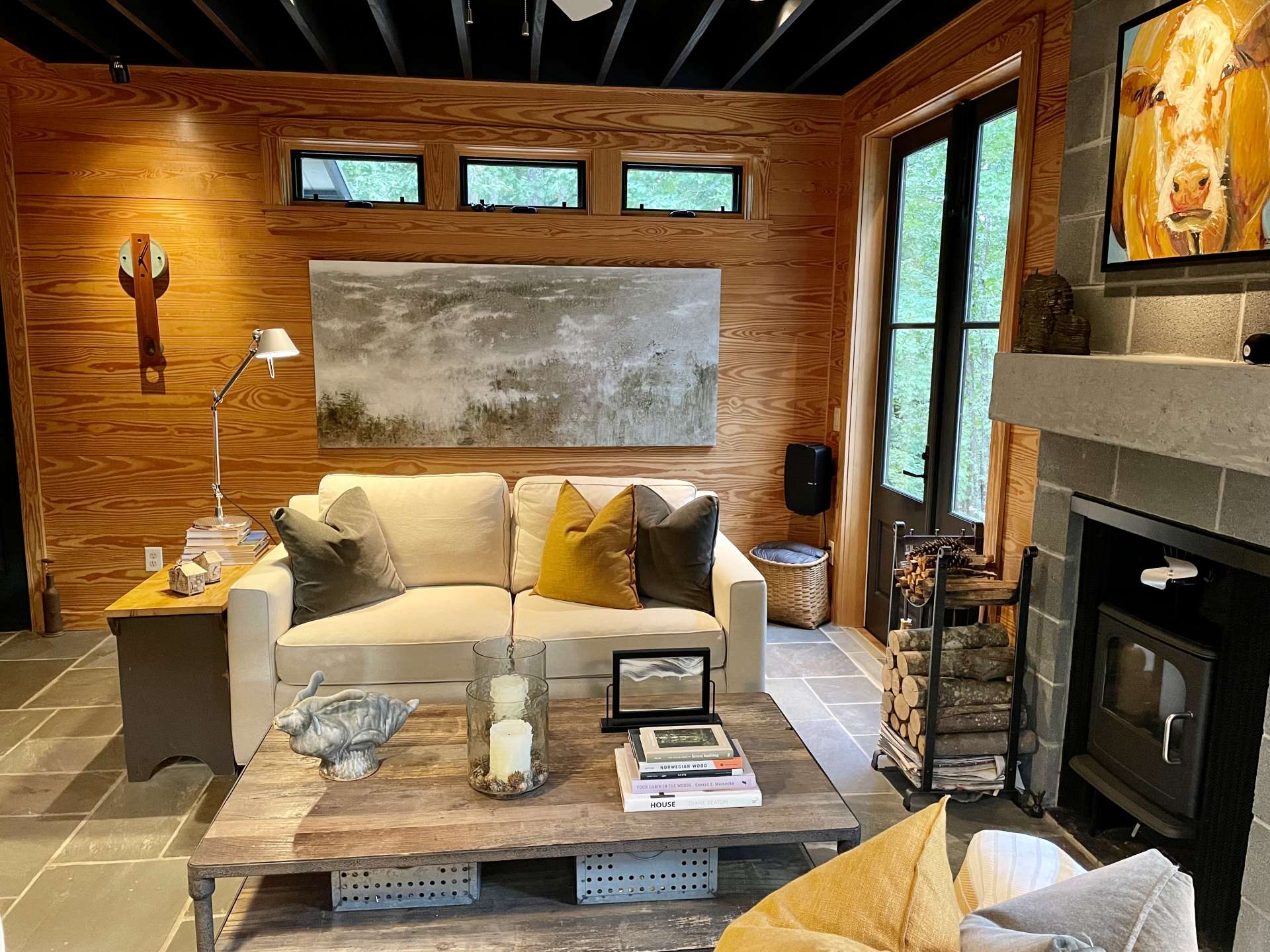 Family room with woodburning fireplace with Morso wood stove.