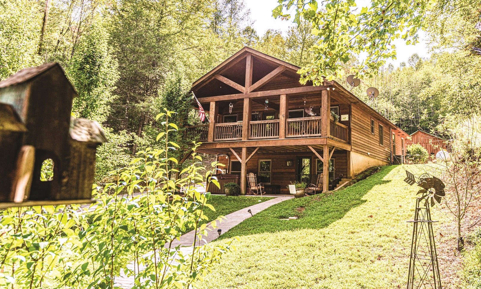 Hidden away on a private 4.85 acre setting in the North Carolina mountains, this 2-bedroom, plus loft, 3-bath cabin offers a truly private mountain retreat complete with pond, natural mountain springs, bunkhouse, barn/workshop, lots of wildlife and fresh mountain air.