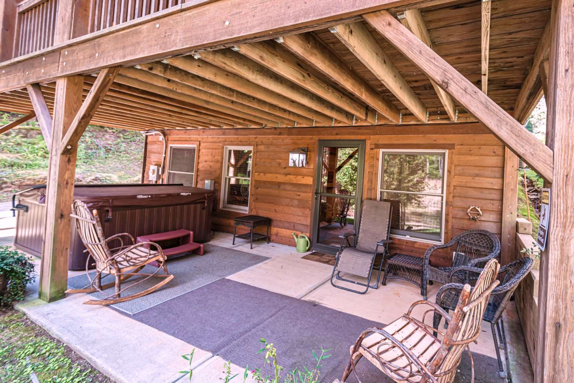 The lower level also enjoys a private covered patio area with hot tub.