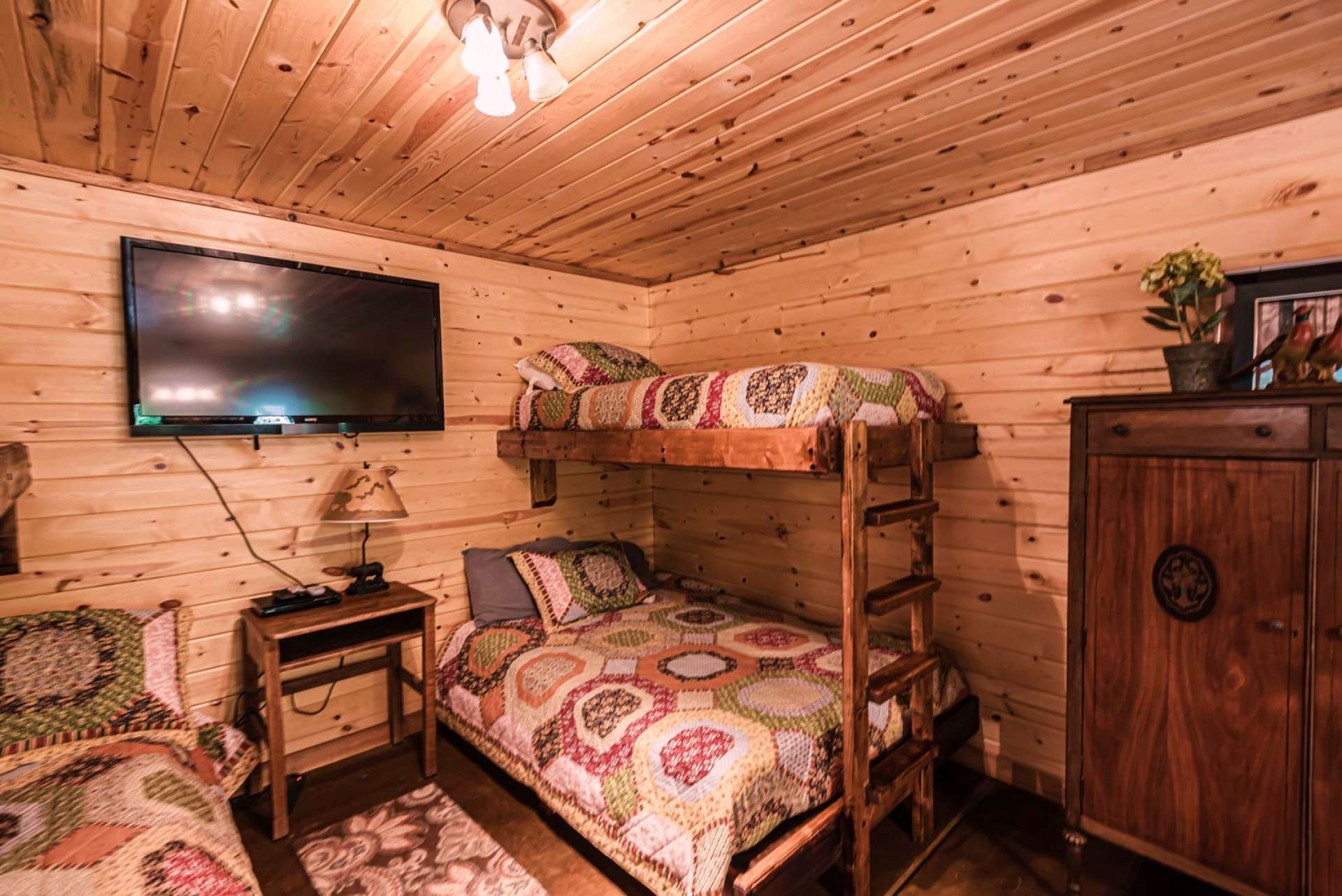The current owners use this property as a vacation rental, so this level has two full size built-in beds, two twin size built-in beds, as well as a queen size free standing bed creating plentiful sleeping space.