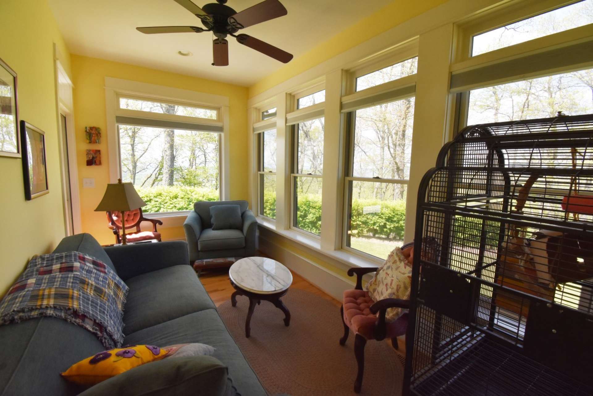 Also located on the main level is this sunroom boasting wood floors and plenty of windows.