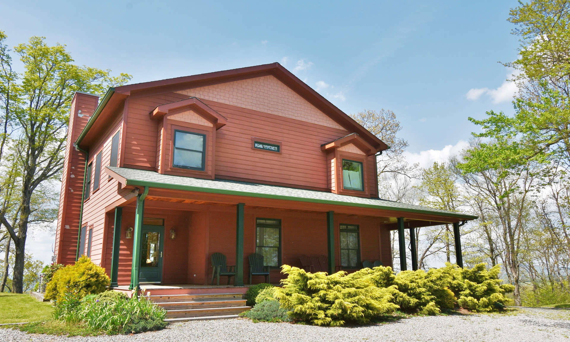 This gorgeous contemporary mountain home is located just off the Blue Ridge Parkway on a private 15 acre setting with fantastic long range mountain views!