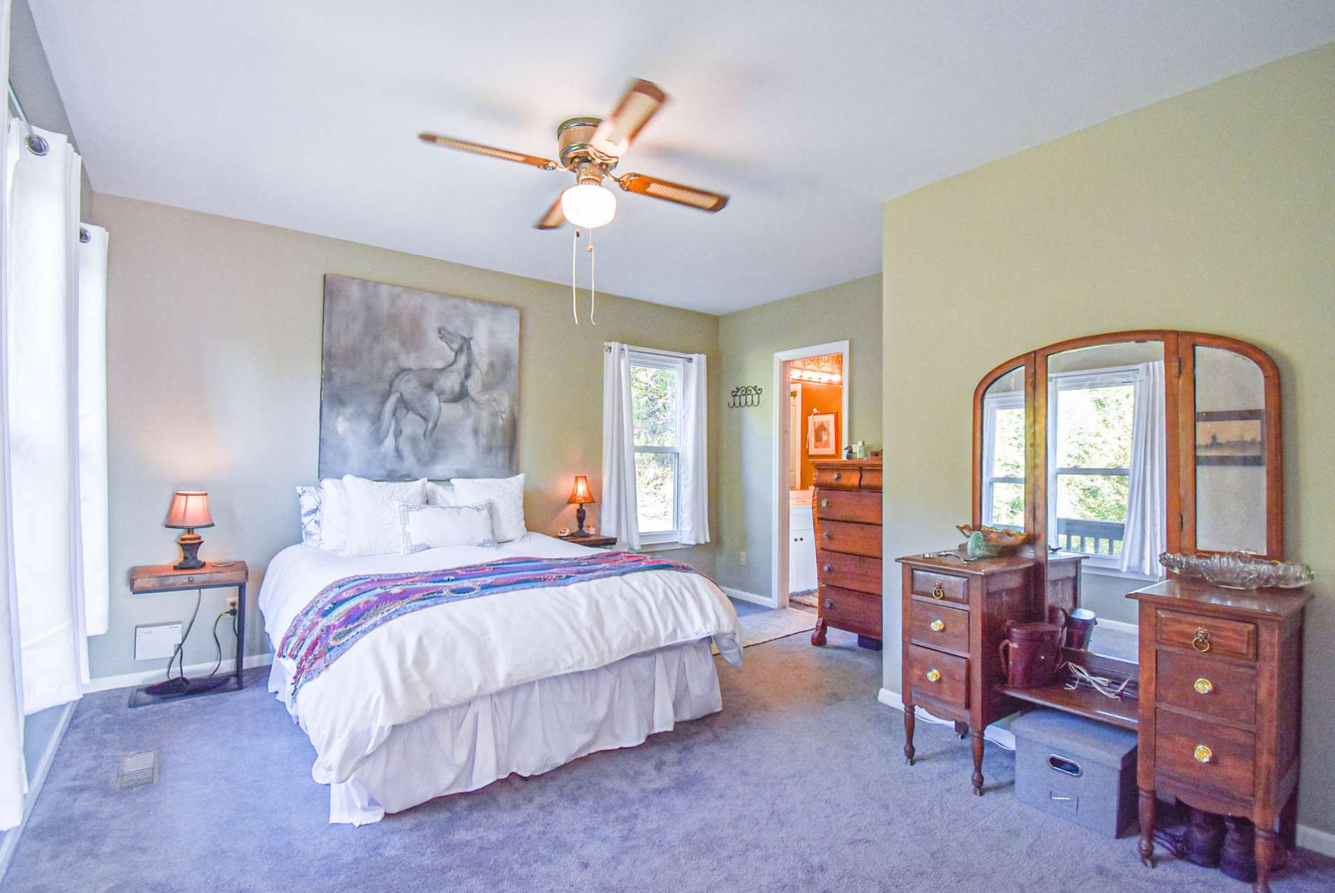 The main level offers a master suite option. This spacious bedroom features lots of light, comfortable carpeted floor, and a full bath.