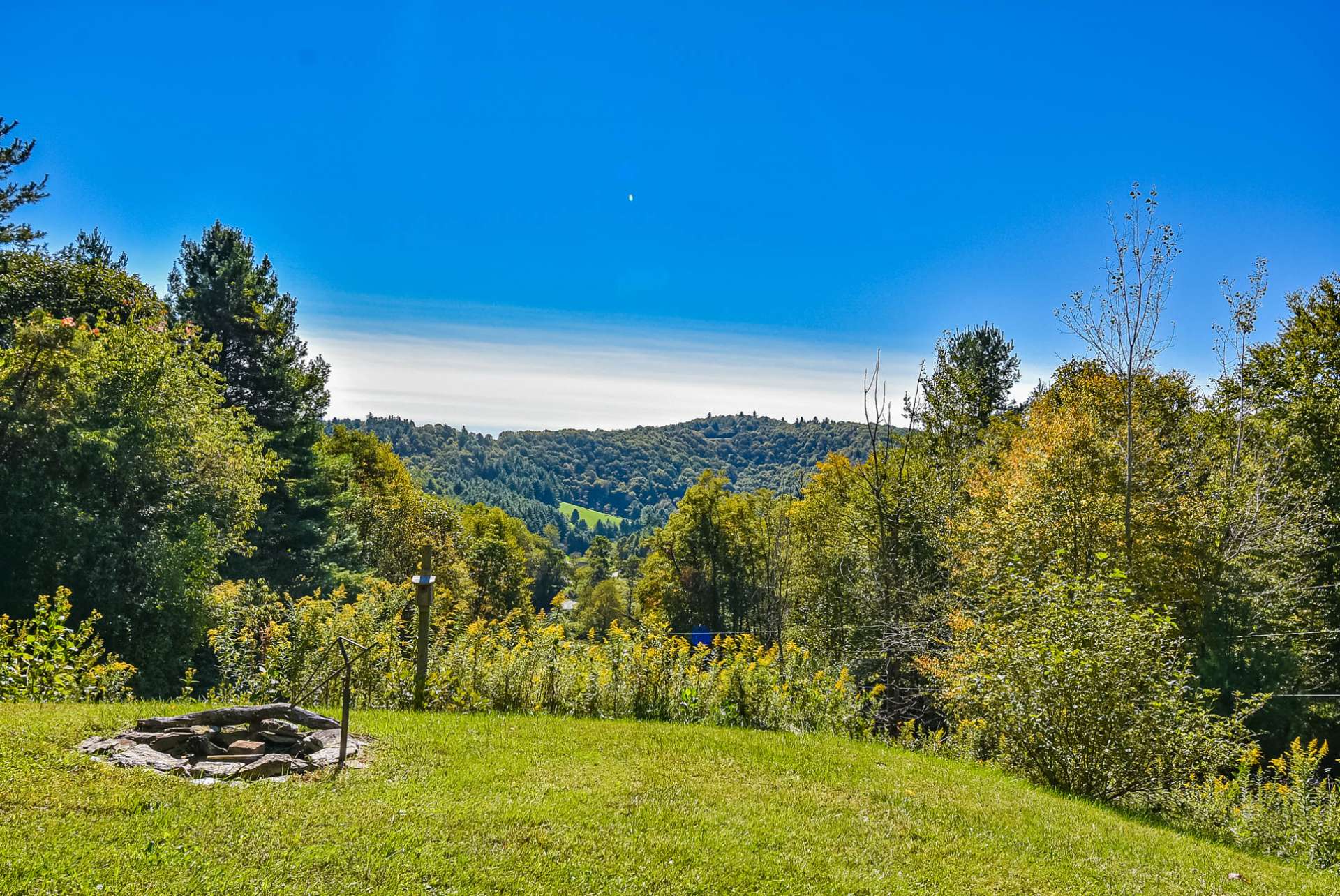 The front yard provides a firepit and a great place to gather with family and friends making smores and sharing old memories while making new memories of time spent in the North Carolina Mountains.
