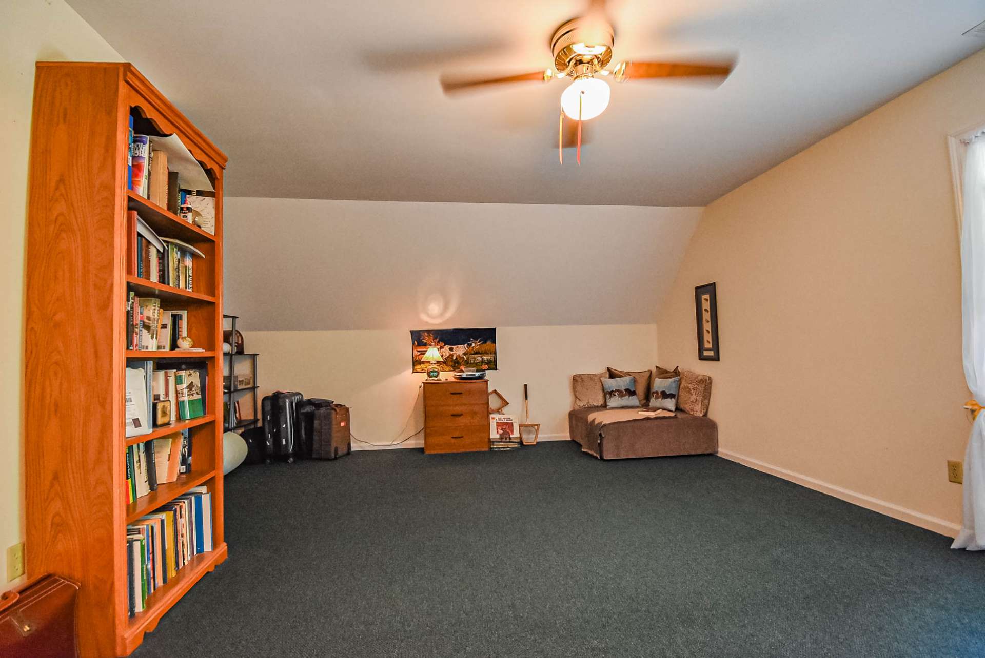 This spacious bedroom on the upper level features a walk-in closet and full bath creating an ideal option for a master suite.