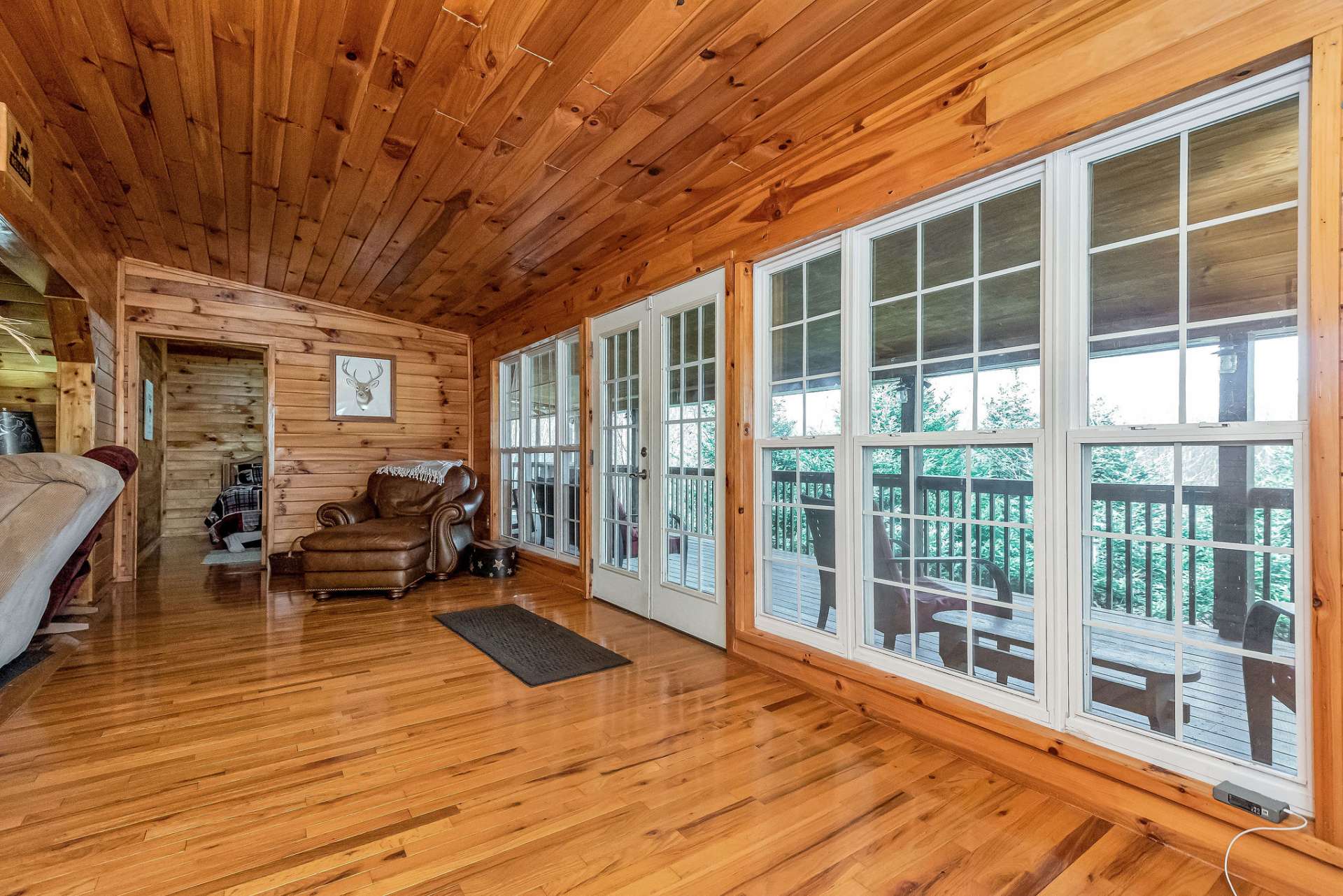 The sunroom brings in the outdoors and natural light.